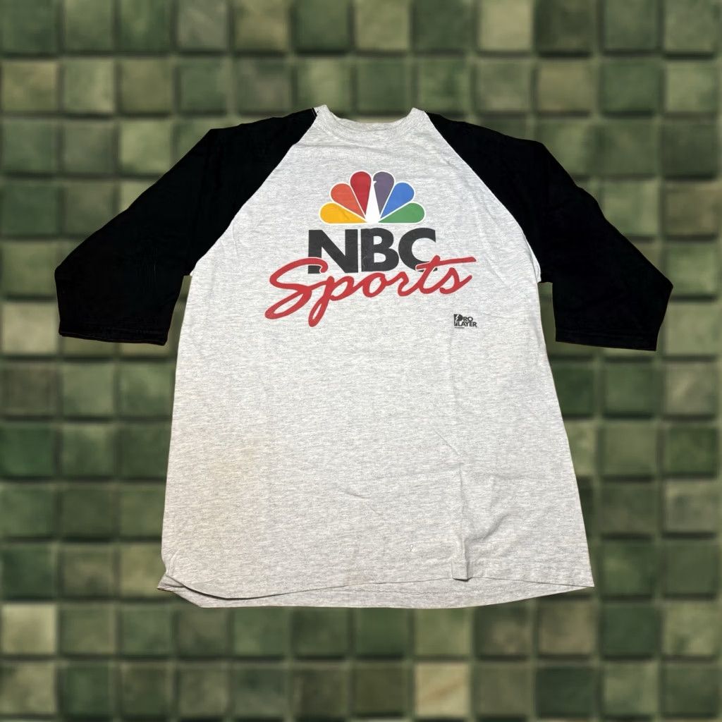Pro Player VINTAGE 90s Pro Player NBC Sports Pro Player Gray Jersey Style T-Shirt XL NFL NBA Mens Short Sleeve Jersey Style T-Shirt Gray XL Men’s Shirt Size US XL / EU 56 / 4 - 1 Thumbnail