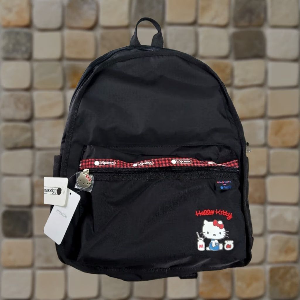 black hello kitty backpack purse Cambridge Satchel The Face Tote from her hand stitched whiskers to her signature bow VINTAGE? No. LeSportsac Hello Kitty