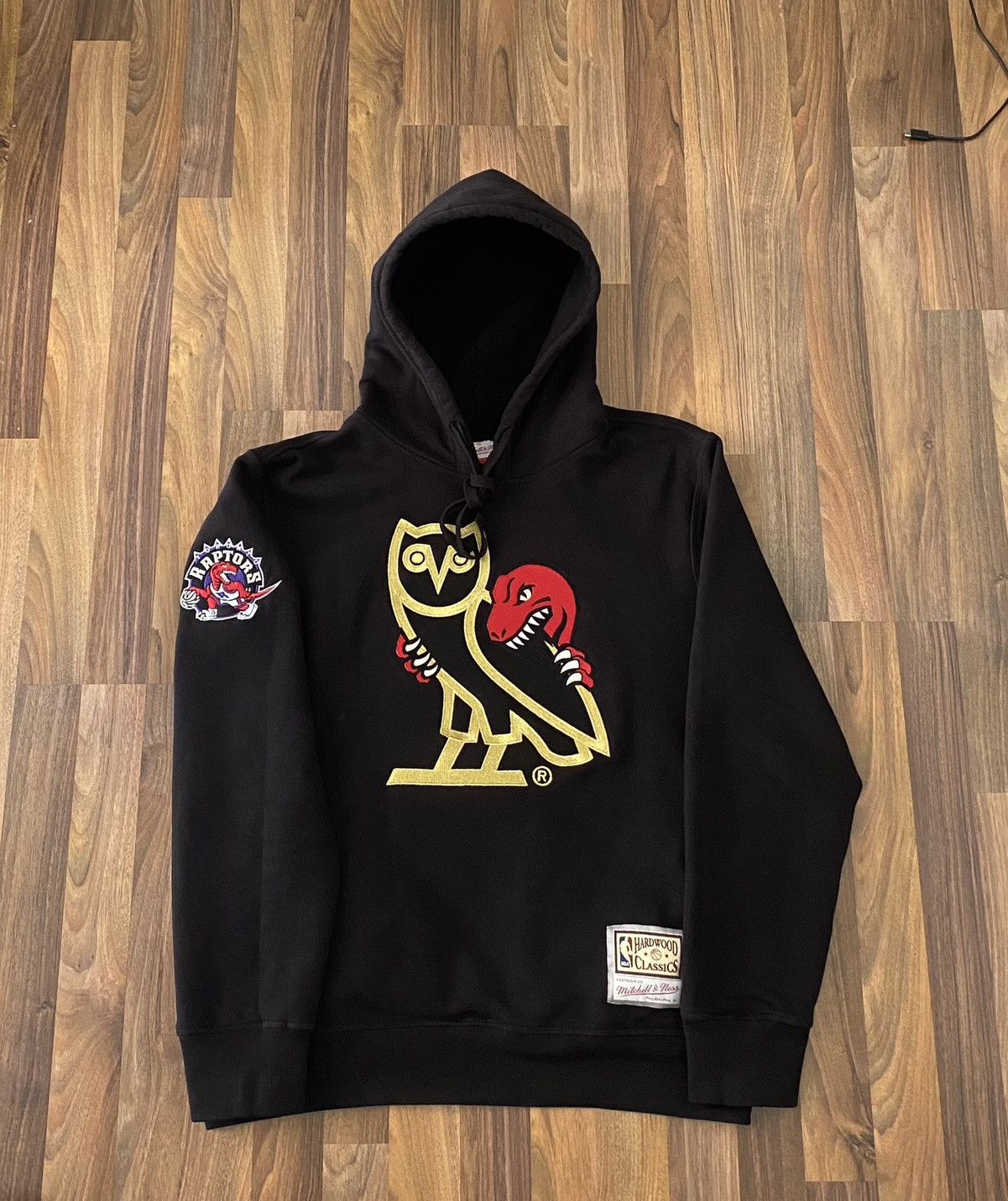 image of Drake x Mitchell Ness Ovo X Mitchell & Ness 1995 X Raptors OG Owl Hoodie in Black, Men's (Size XL)