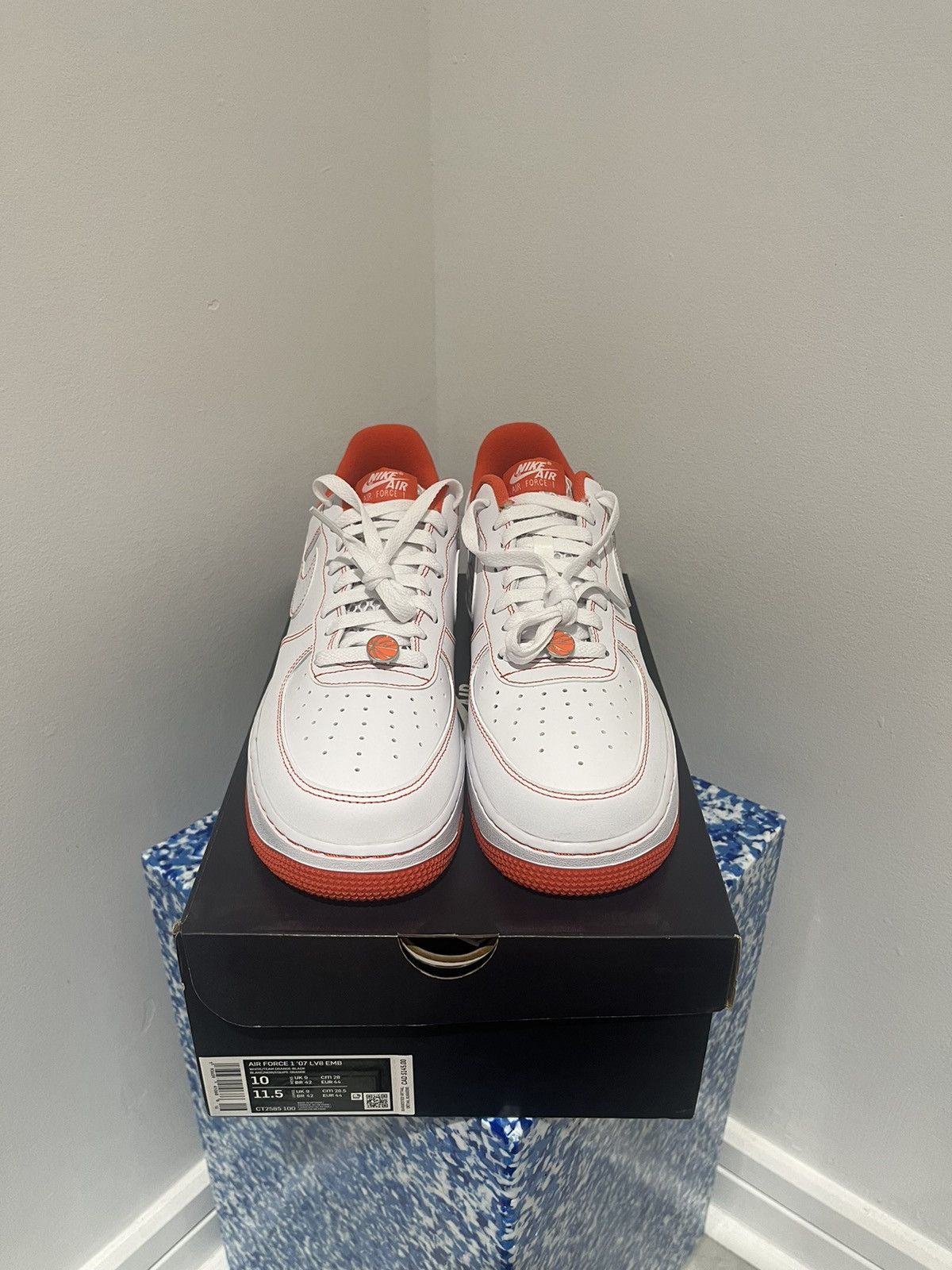 image of Nike Air Force 1 '07 Lv8 Emb “Kobe Rucker” Shoes in White/Orange, Men's (Size 10)