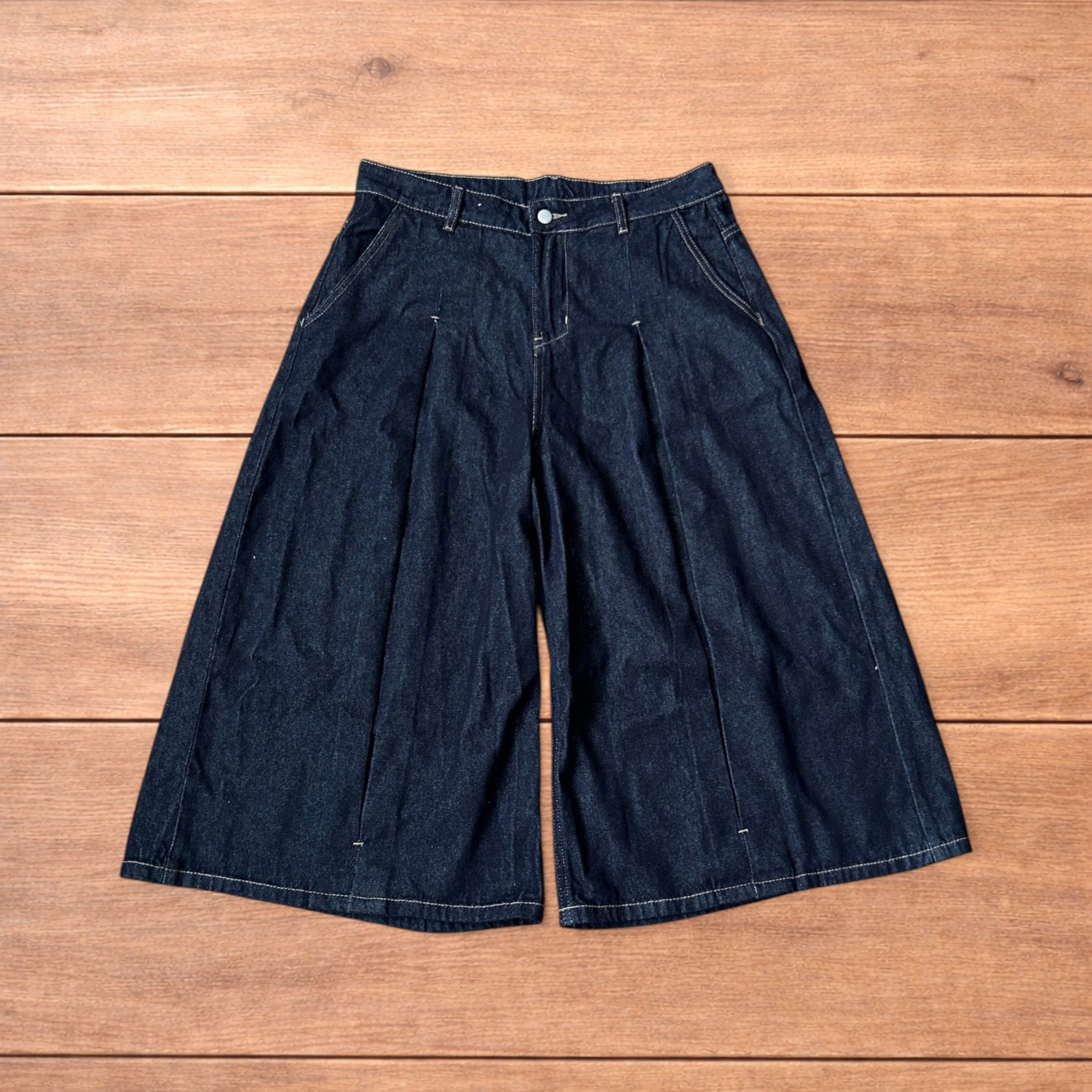 Super baggy wide raw denim 3/4 shorts jorts in dark blue.