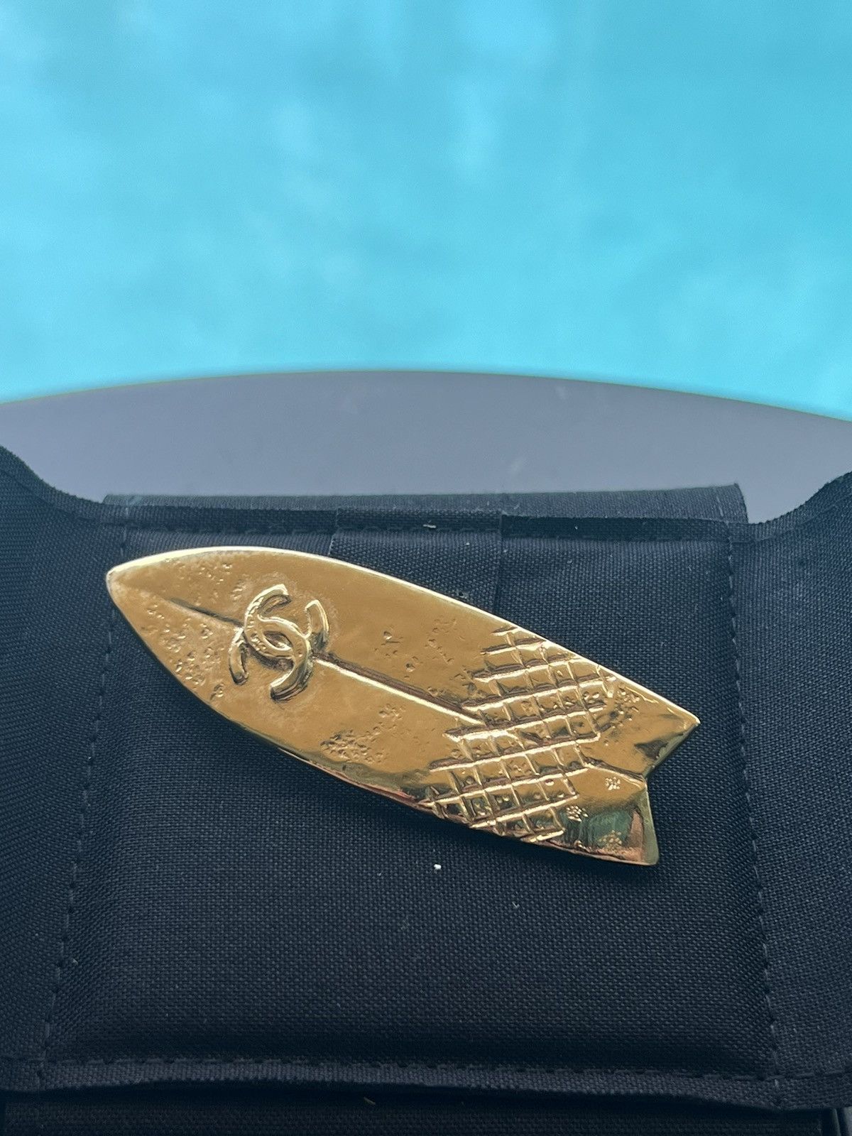 Amazing Chanel gold surfboard brooch.
