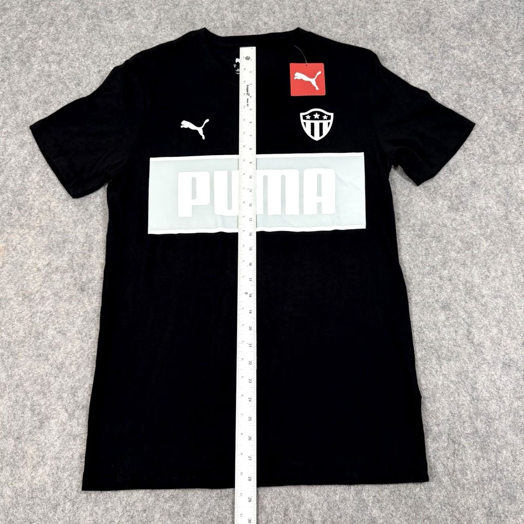Puma Puma Soccer Shield Badge Sport Short Sleeve T-Shirt Mens Black Small Cotton Knit Shirt 38in Chest 28.5in Length Size US S / EU 44-46 / 1 - 5 Thumbnail