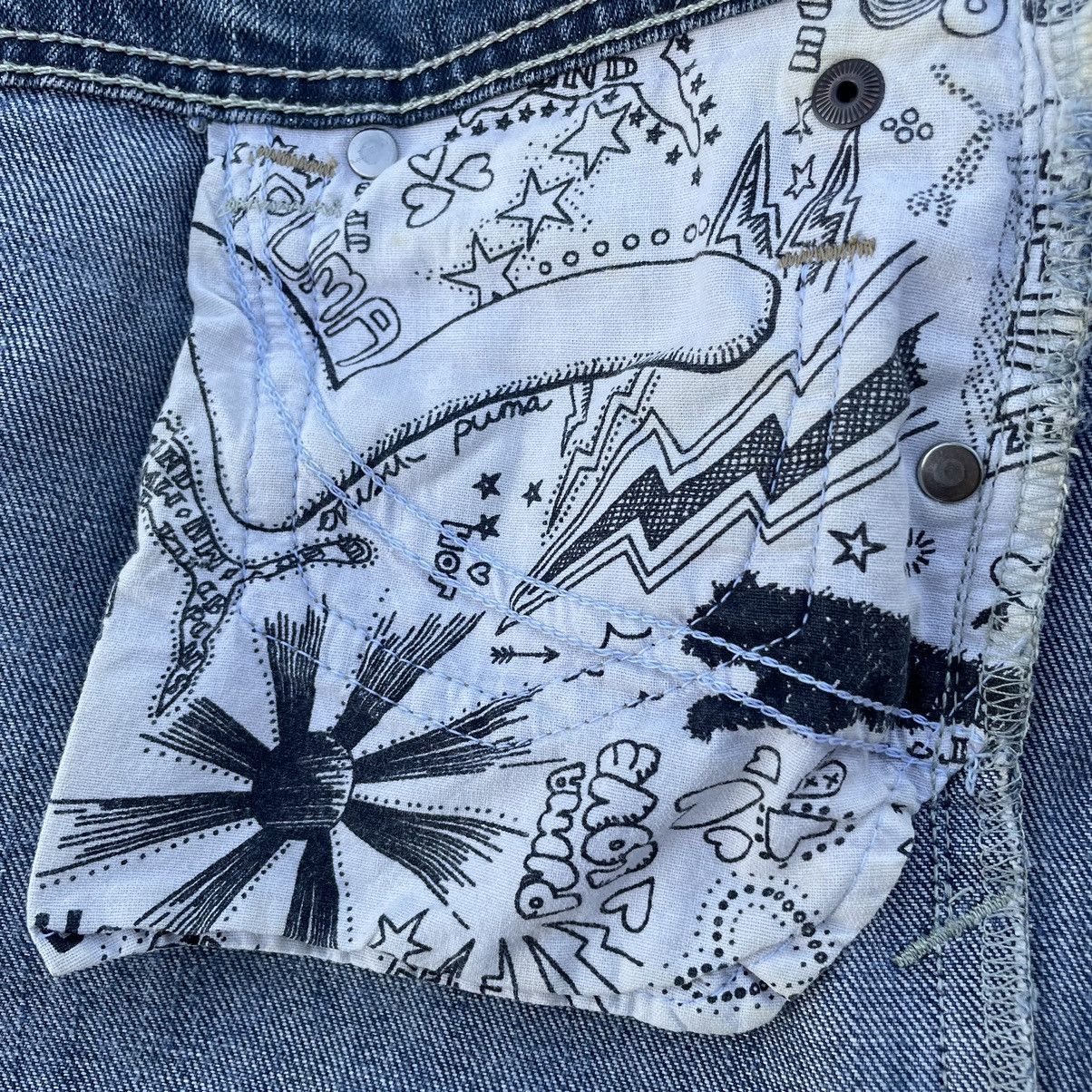 VINTAGE Y2K EVISU X PUMA DISTRESSED WASHED DENIM PANTS