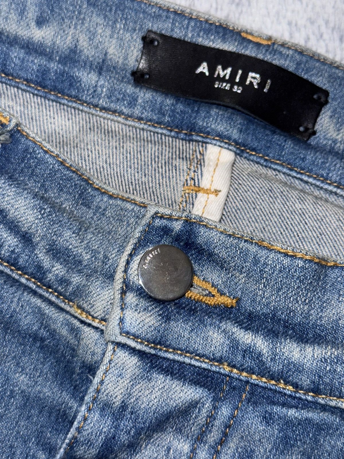 AMIRI BLUE DISTRESSED JEANS