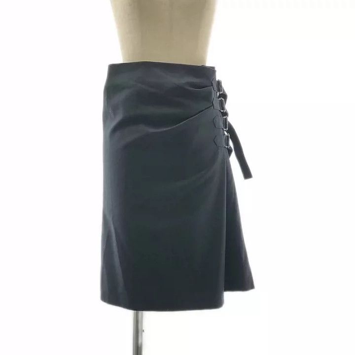 DRIES VAN NOTEN A wool skirt decorated with straps