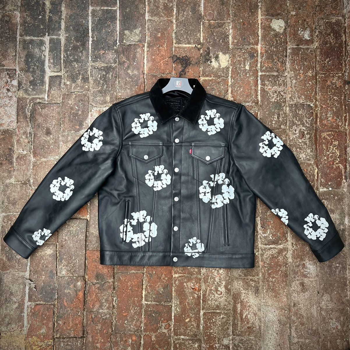 DENIM TEARS Denim Tears Leather Embossed Wreath Puffer Jacket