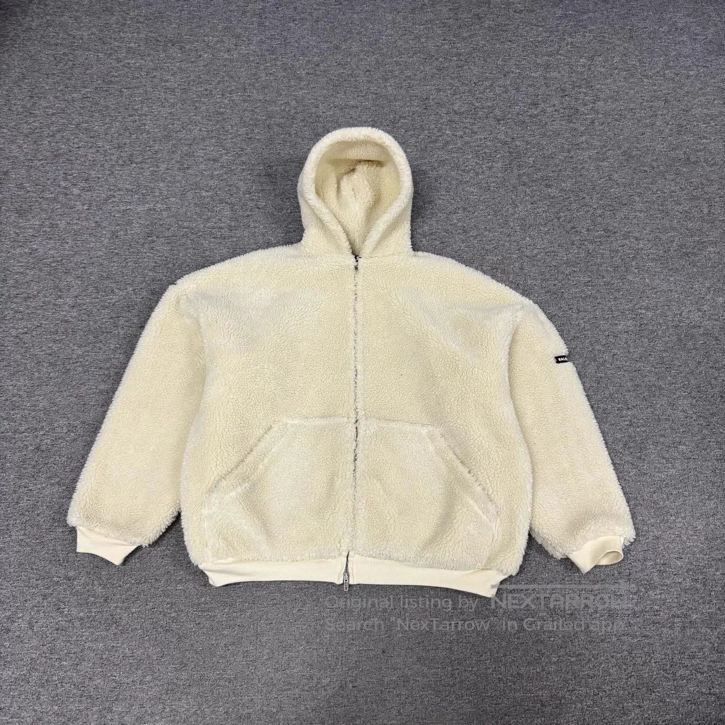 Beige Zip-Up Fleece Hoodie with Hood and Pockets.