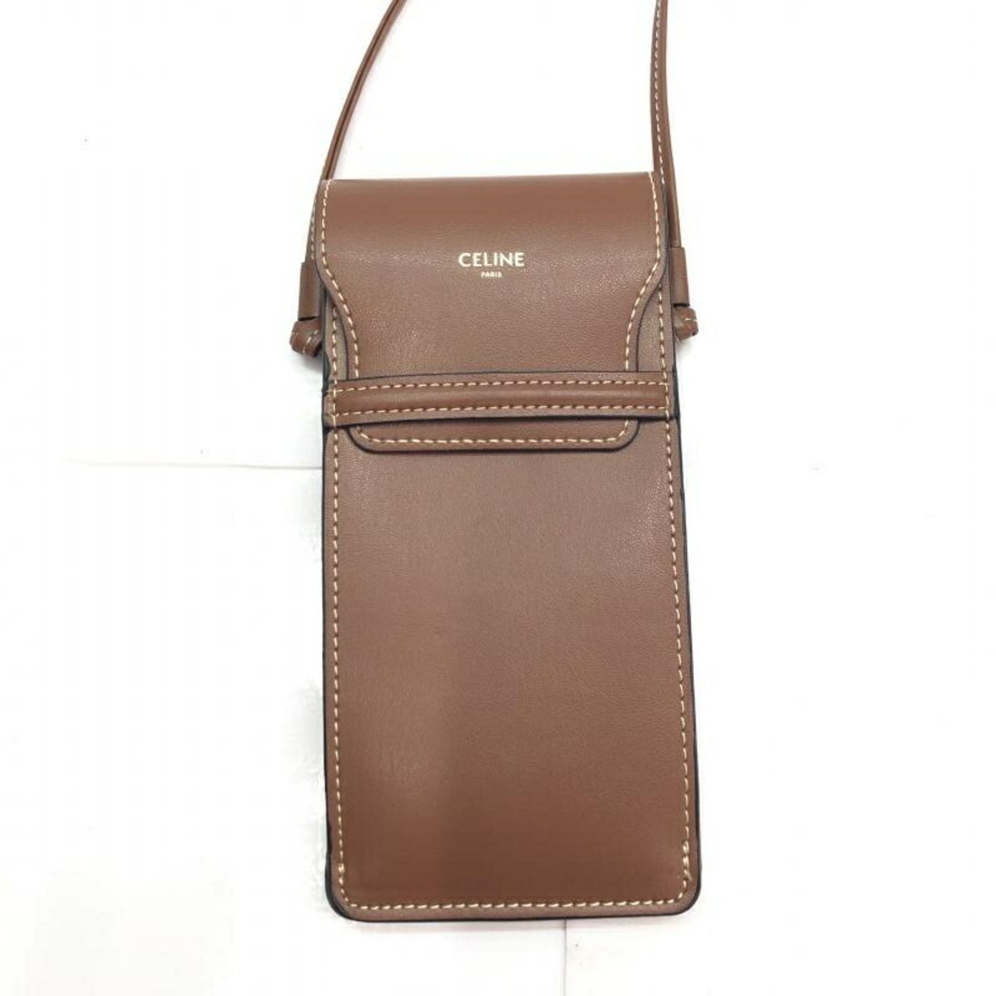 image of Celine Céline Triomphe Clutch in Brown, Women's