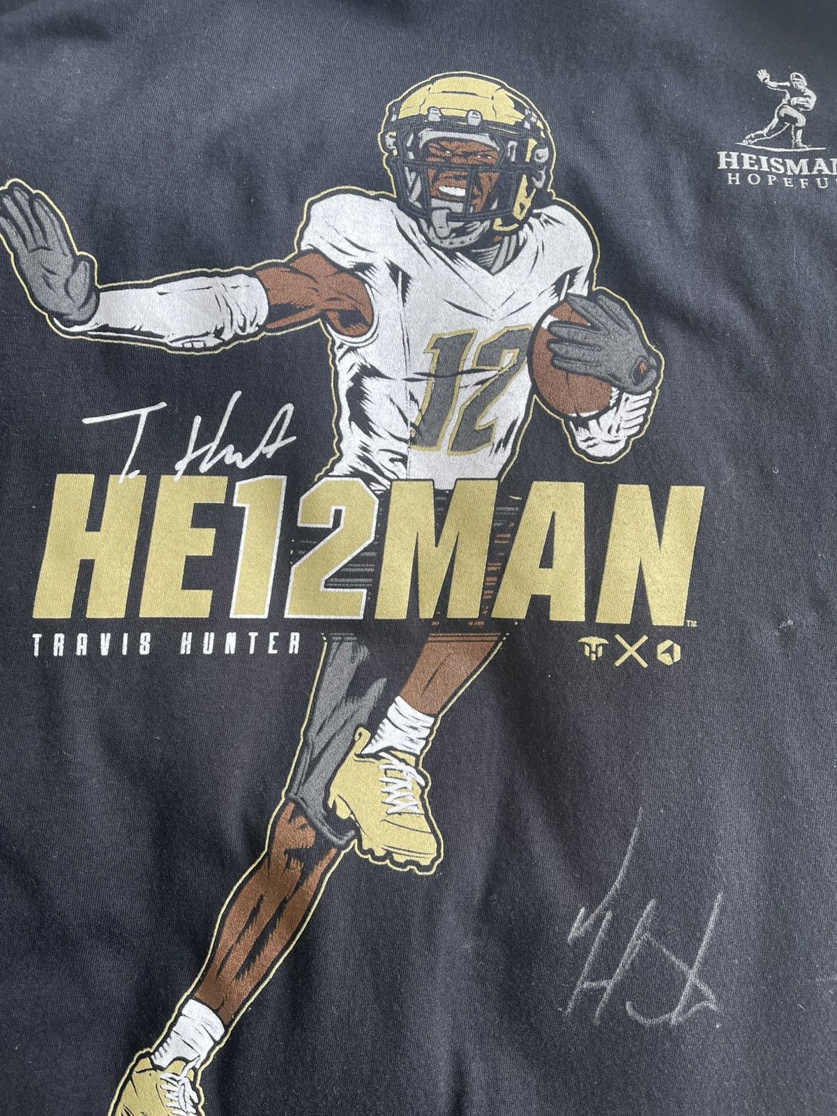 NCAA SIGNED Travis Hunter THE HE12MAN rock’em tee shirt Size US M / EU 48-50 / 2 - 5 Thumbnail