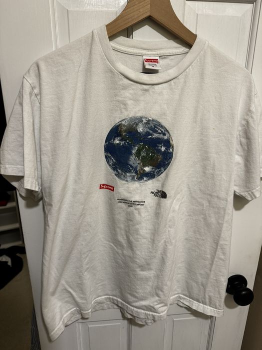 Supreme x the north store face one world tee