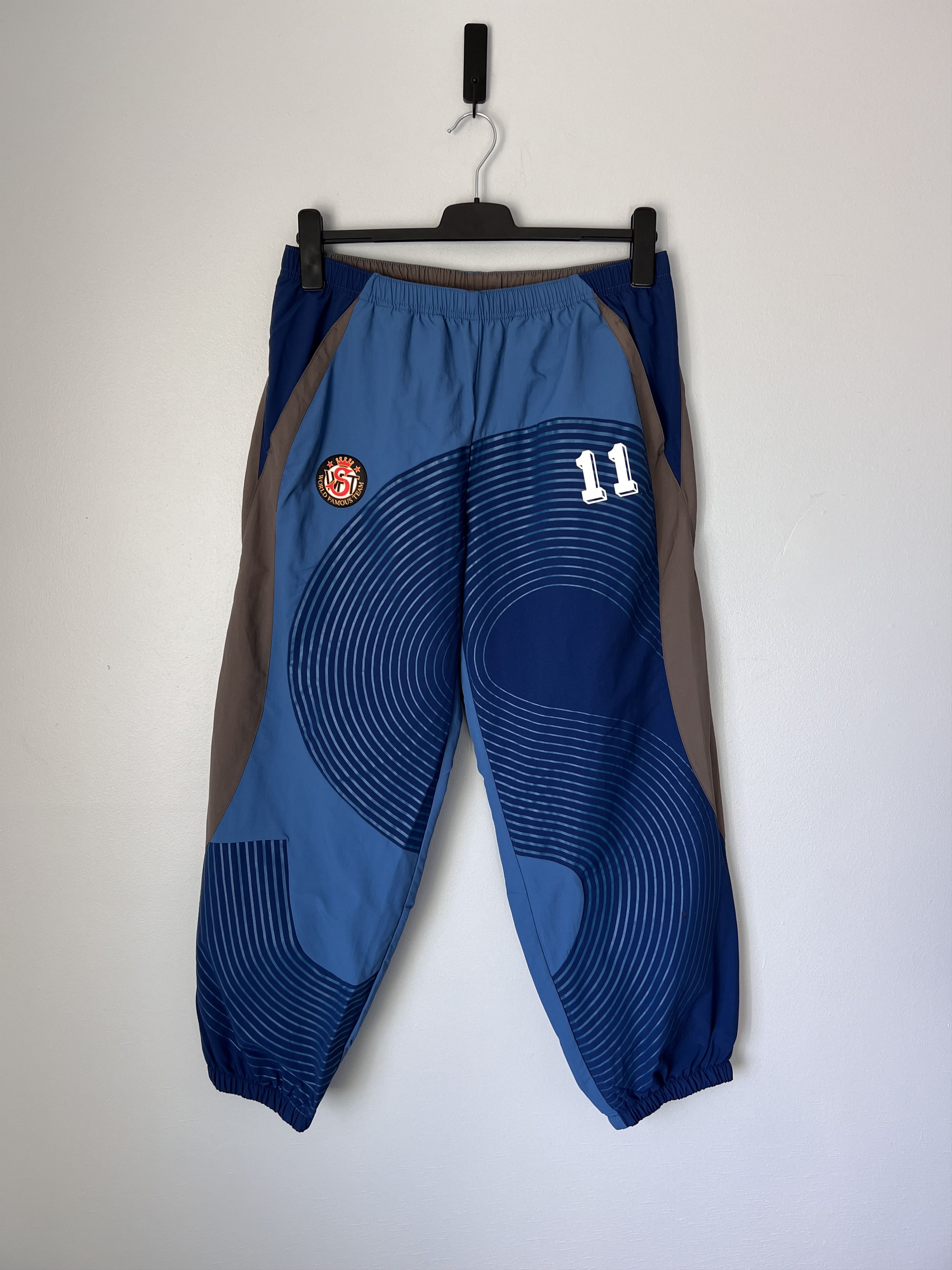 Supreme S Logo Track Pants in Navy Blue Bottoms