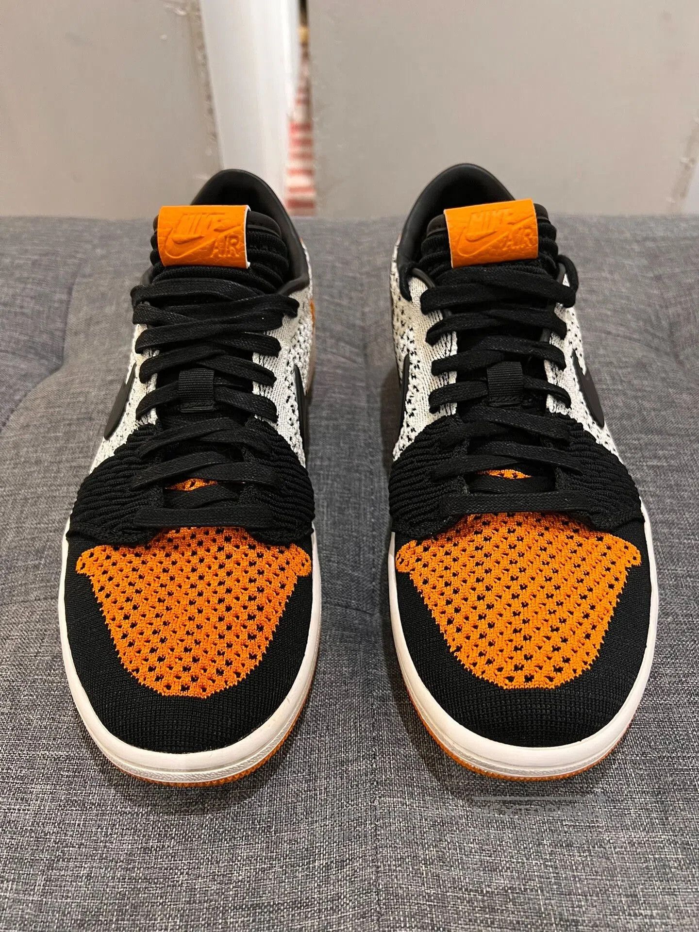 Jordan Brand aj1 low flyknit black orange sneakers. Size US 9.5 / EU 42-43 - 2 Thumbnail
