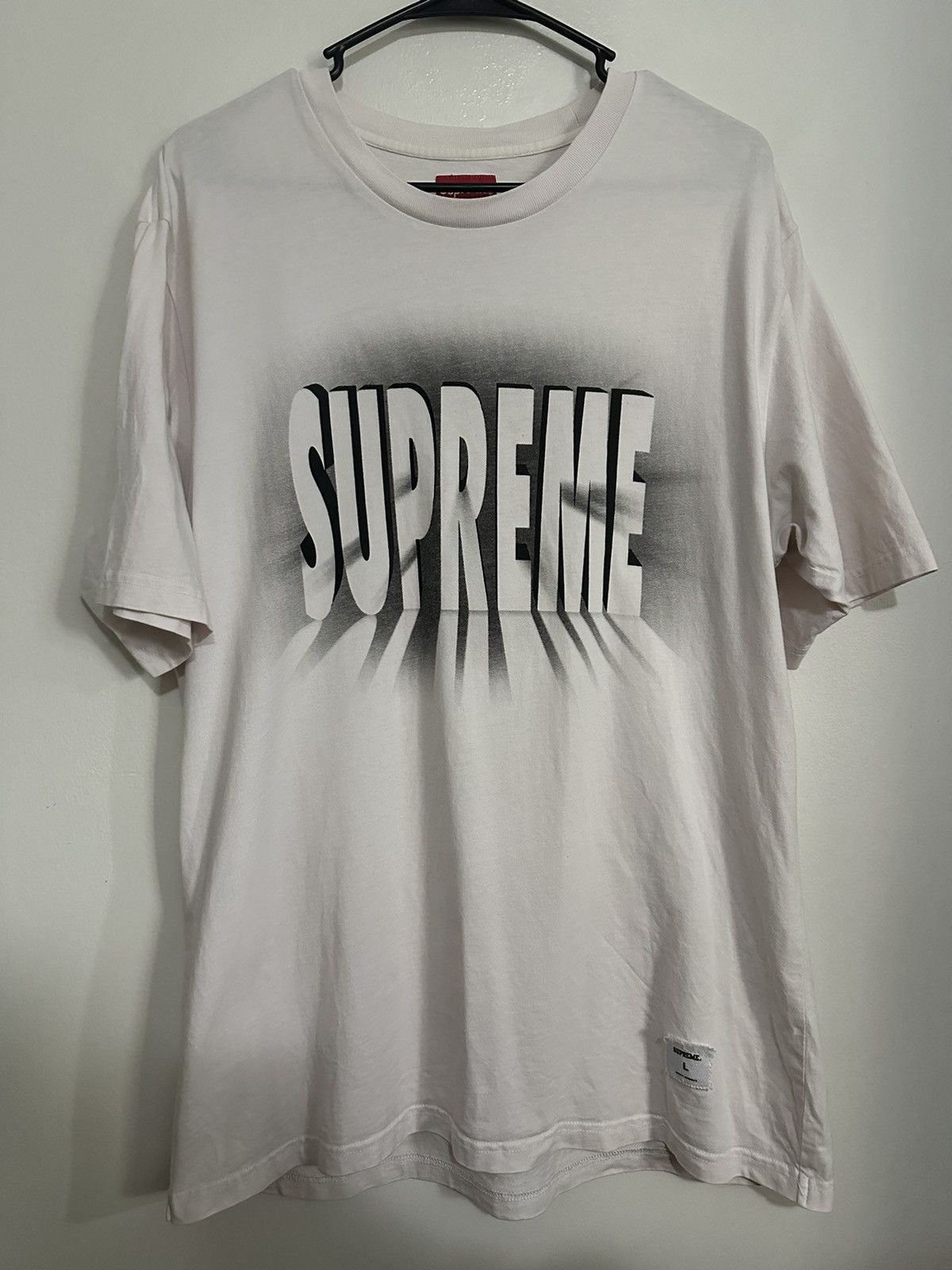 Supreme light tee hotsell