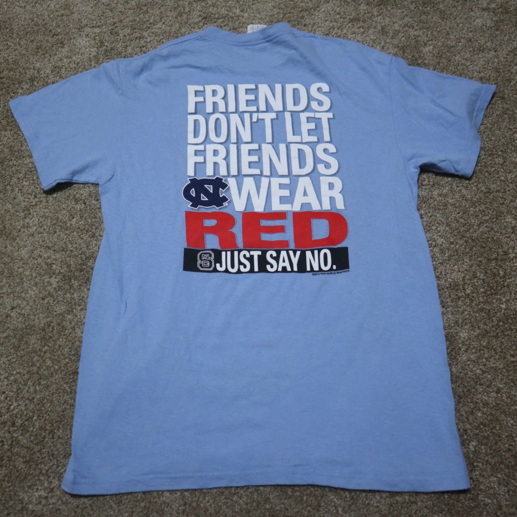 Delta NCAA "Friends Don't Let Friends Wear Red..." Tar Heel Backer Blue T Shirt Medium Mens Size US M / EU 48-50 / 2 - 6 Thumbnail