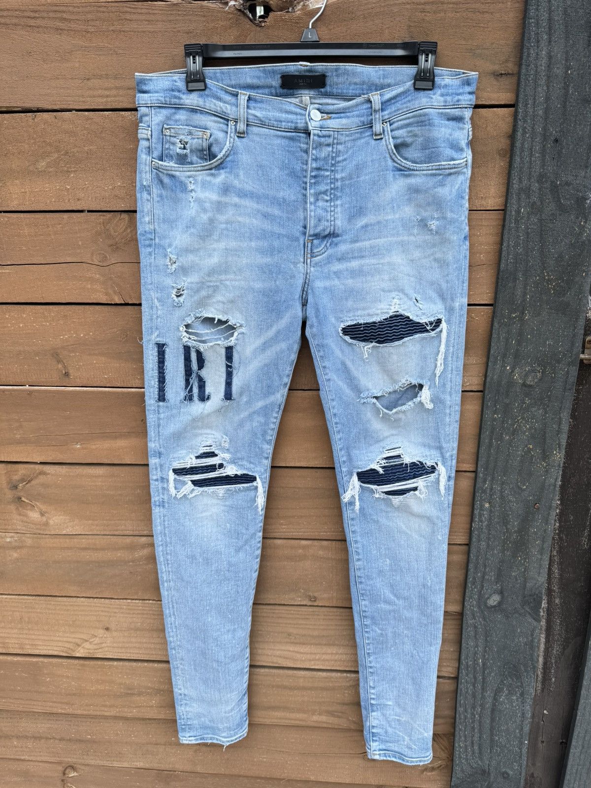 image of Amiri Appliqué-Logo Distressed Jeans Size 36 in Blue, Men's