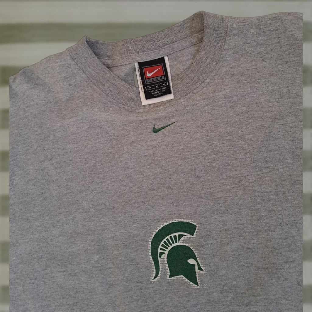 Nike **90s Michigan State U. Printed Nike Gray Crew Neck T-Shirt Med** User: VINTAGE Michigan State U. Printed Nike Gray Crew Neck T-Shirt Med 90s **M** Size US M / EU 48-50 / 2 - 1 Thumbnail