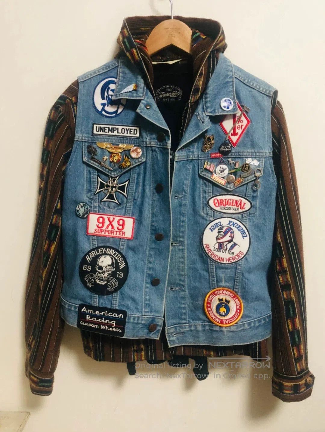 denim vest with patches and designs.