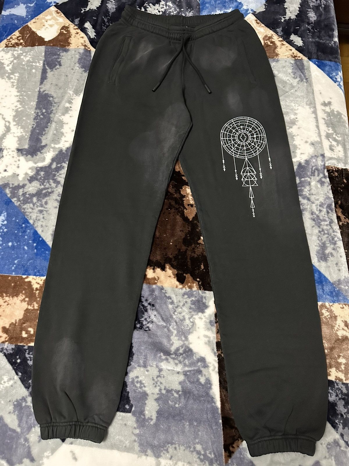 MARCEL BURLON ASTRAL SWEATPANTS.