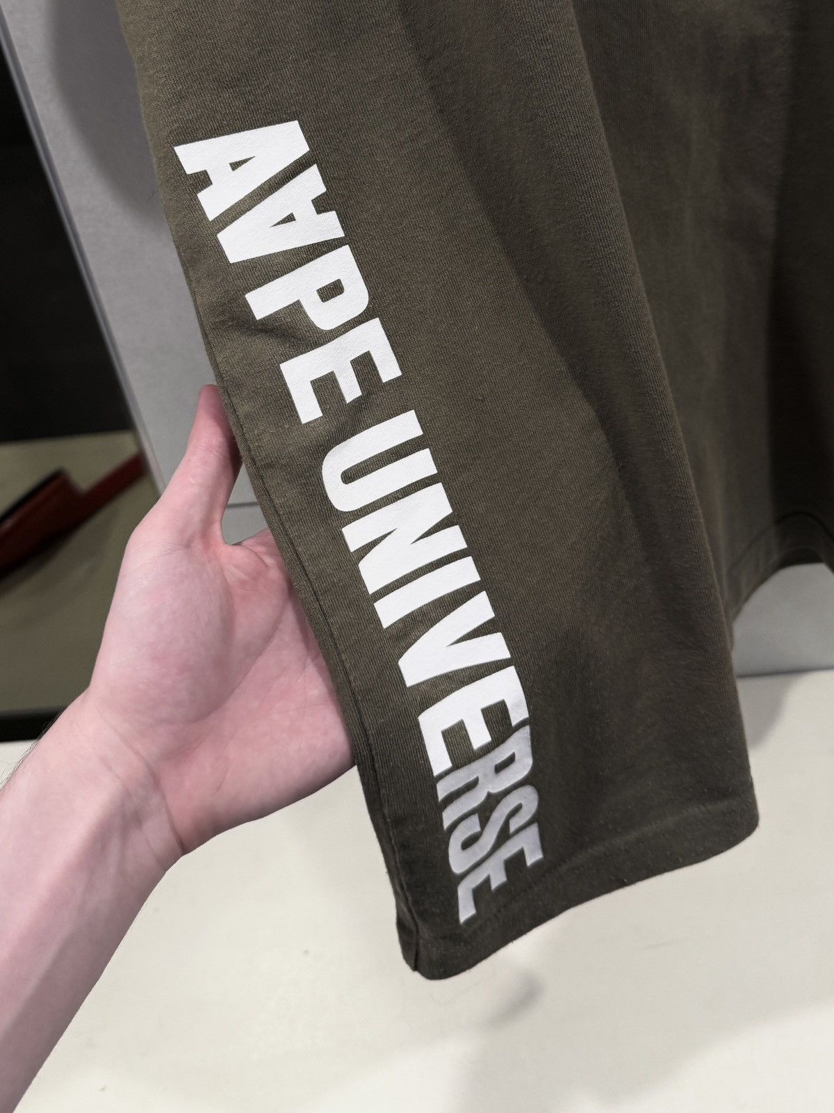 Aape AAPE UNIVERSE UNVS REFLECTIVE CAMO TEE OLIVE XL LOGO GRAPHIC Size US XL / EU 56 / 4 - 6 Thumbnail
