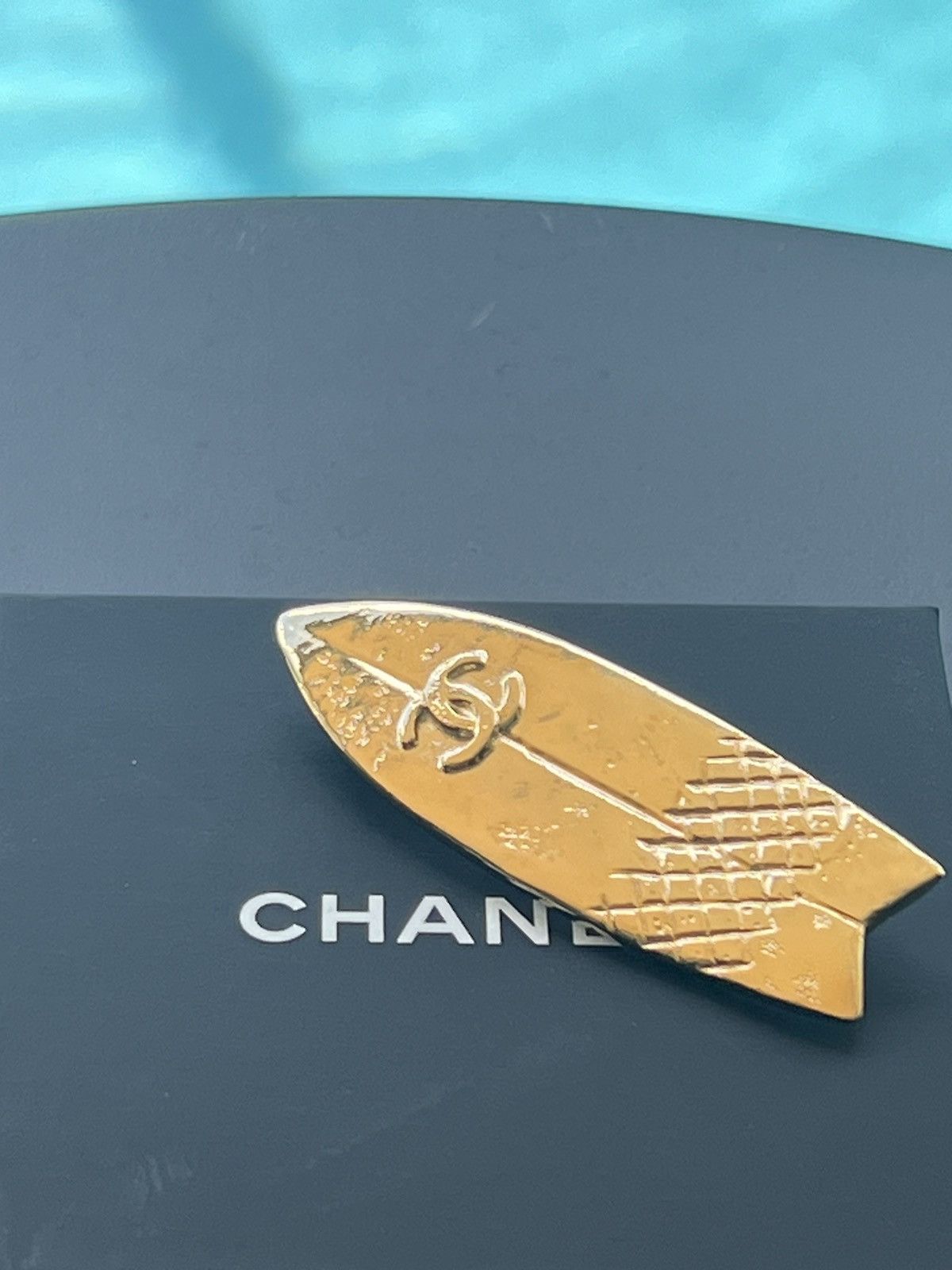 Amazing Chanel gold surfboard brooch.