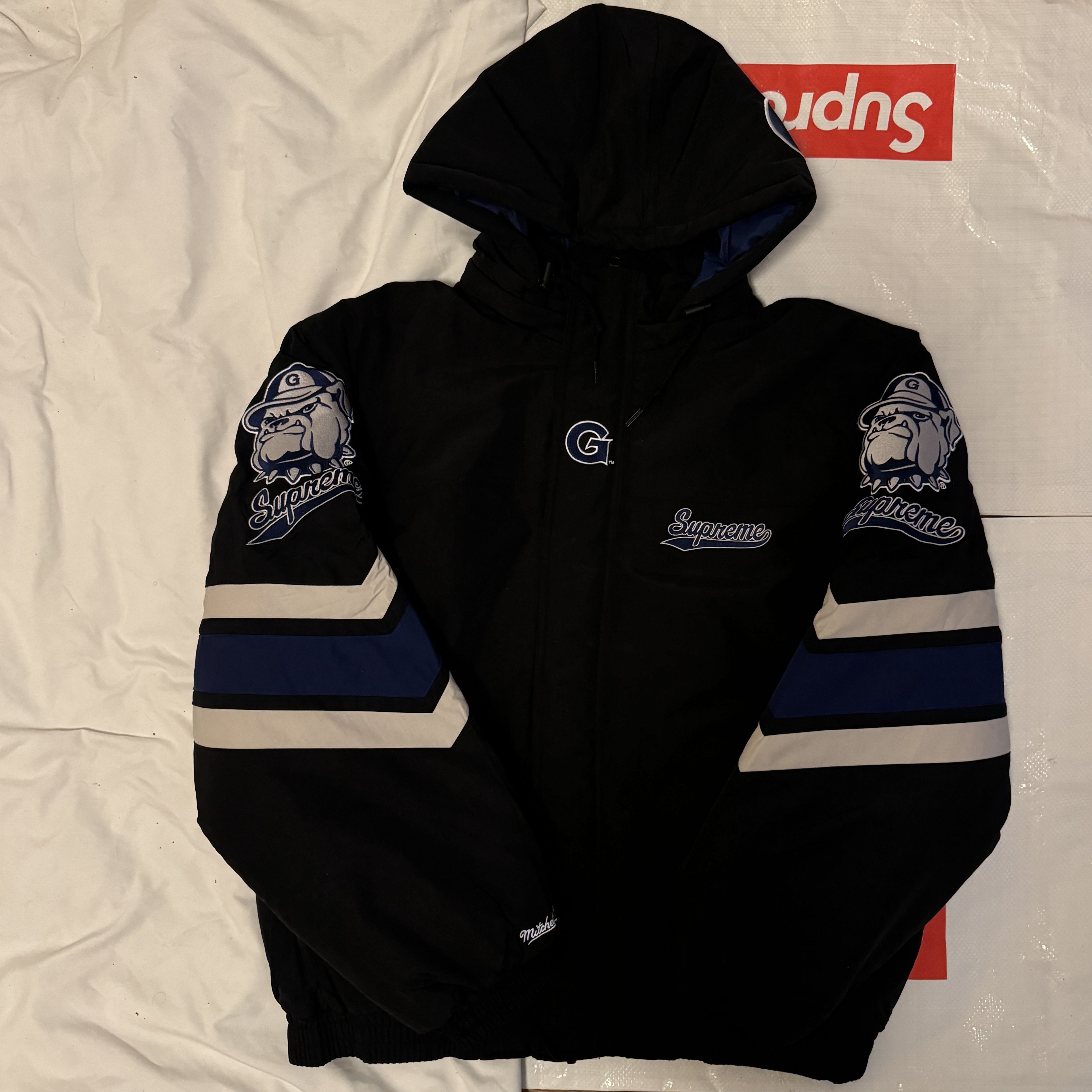 Supreme®/Mitchell & Ness NCAA Hooded Stadium Jacket