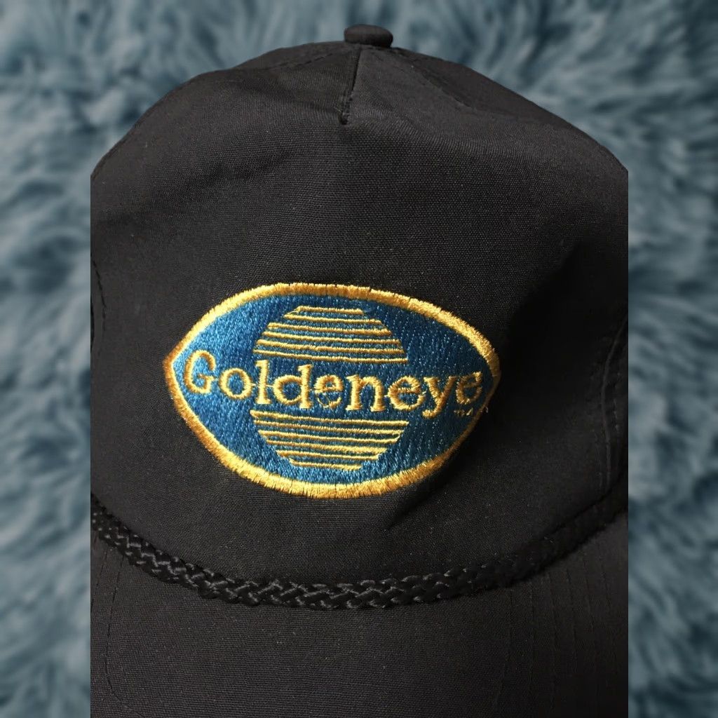 Vintage VINTAGE Goldeneye Strapback Hat Trucker Biker Workwear Grunge Punk Skate USA Men Adjustable Black Hat Size ONE SIZE - 1 Thumbnail