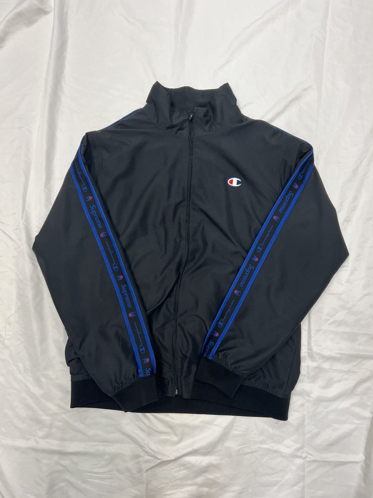 Champion supreme track jacket best sale