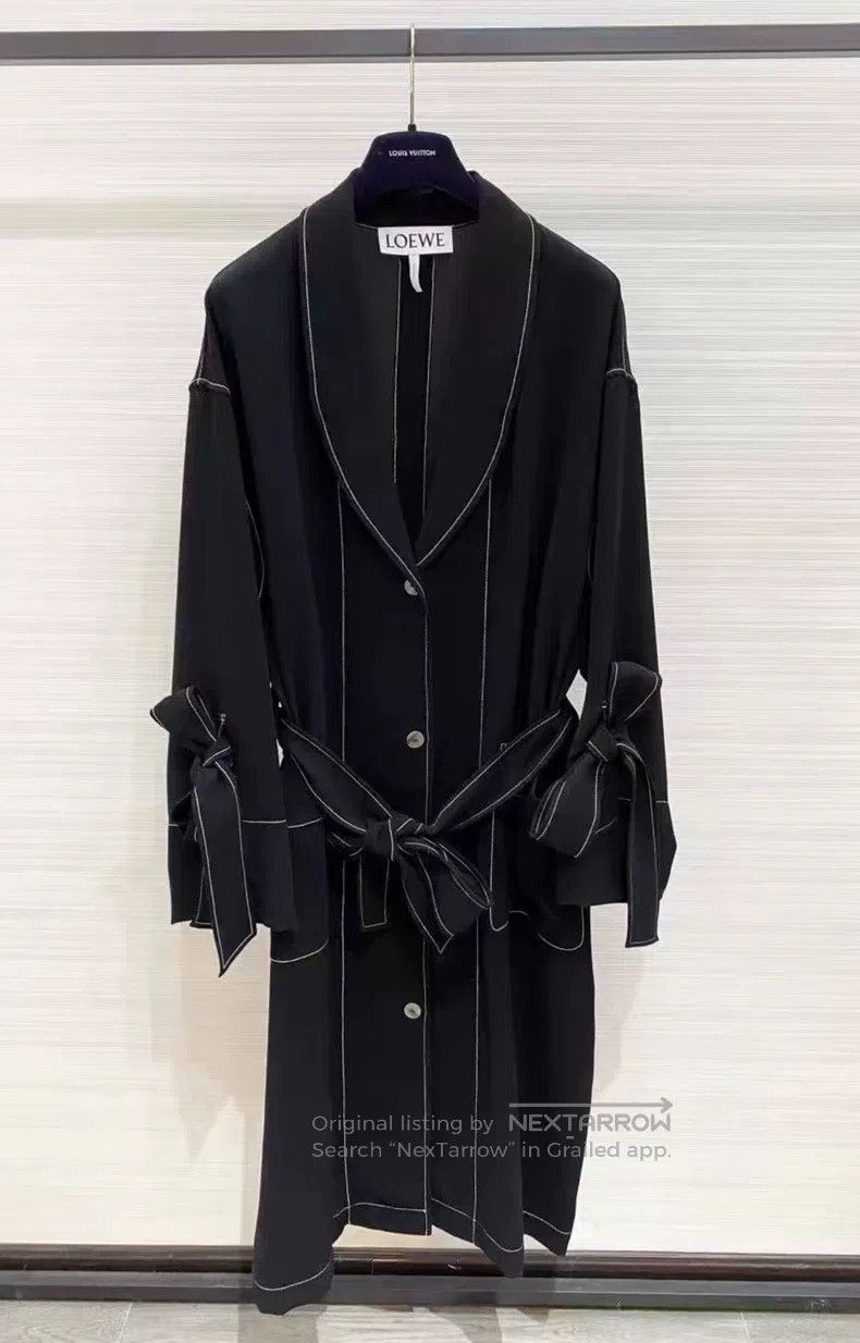 Loewe Fashion show piece with exposed seams and bow detail