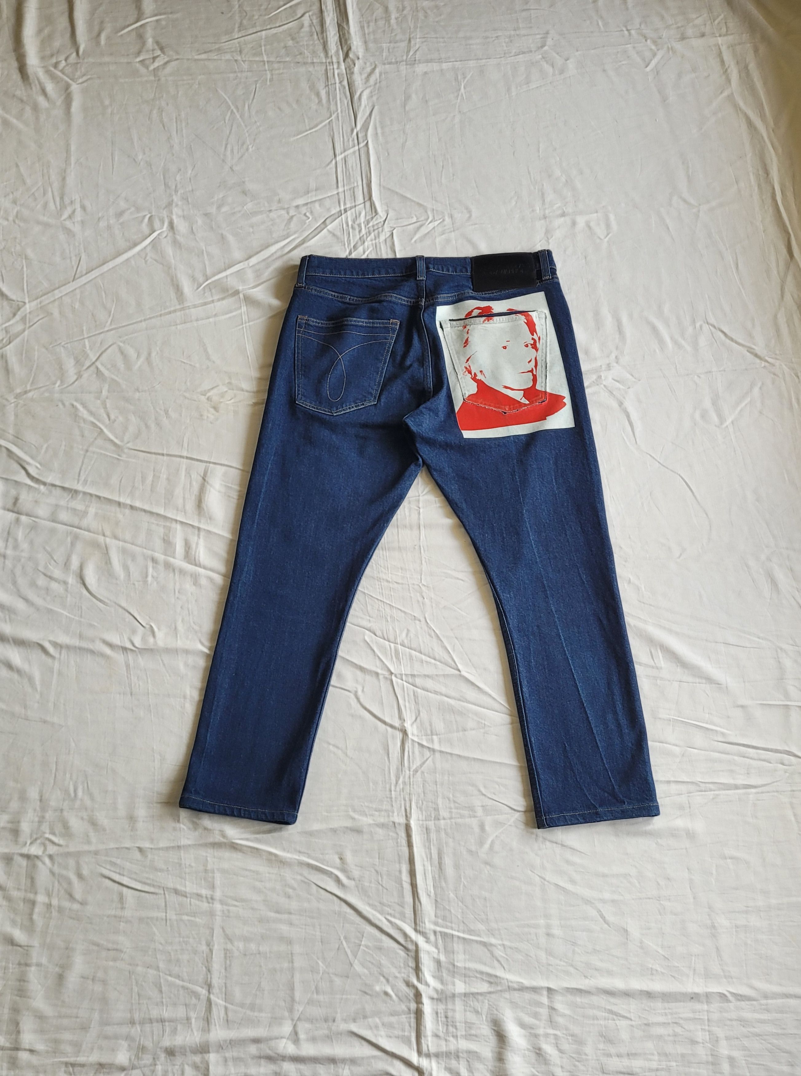 Calvin Klein by Raf Simons raw denim printed jeans