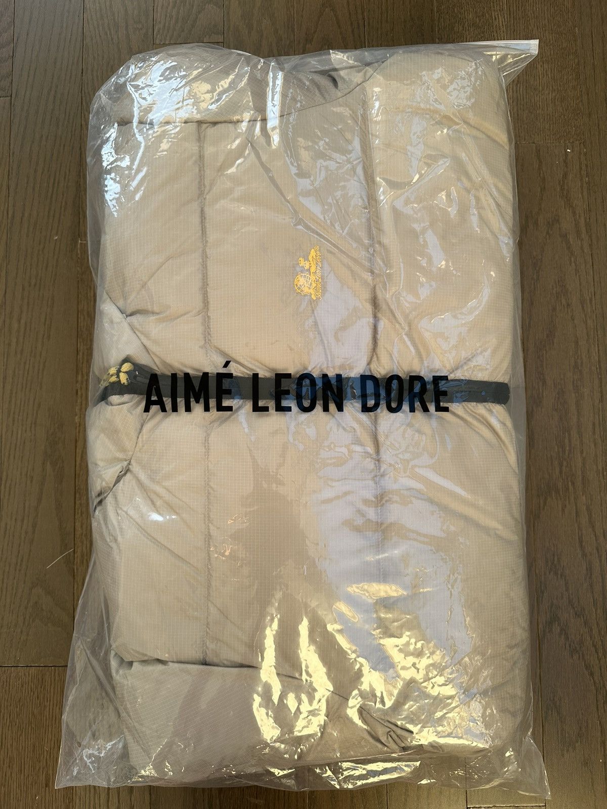 image of Aime Leon Dore Unisphere Down Puffer Jacket in Brown, Men's (Size Medium)