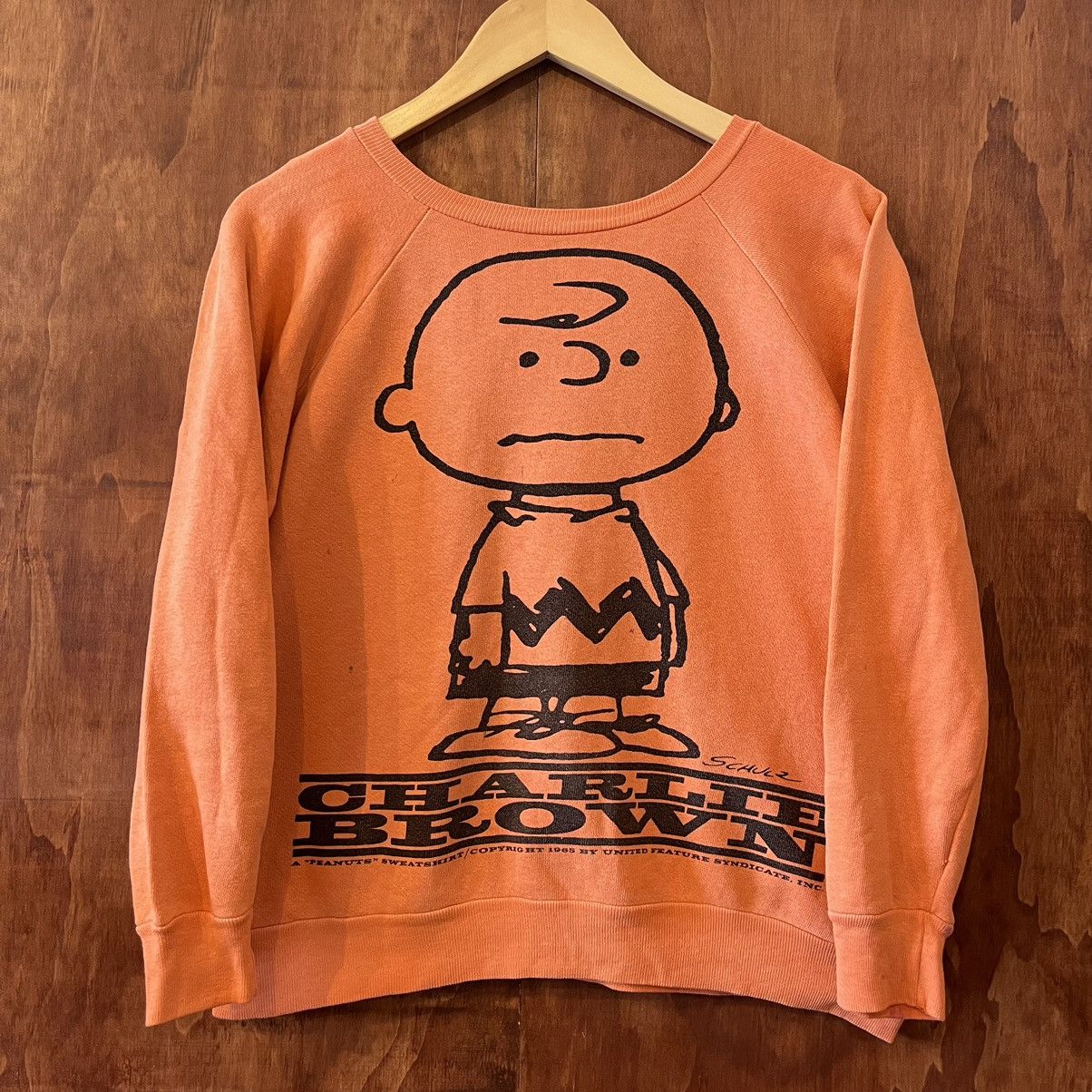 image of Vintage Peanuts 1965 Charlie Brown Sweatshirt in Orange, Men's (Size Small)