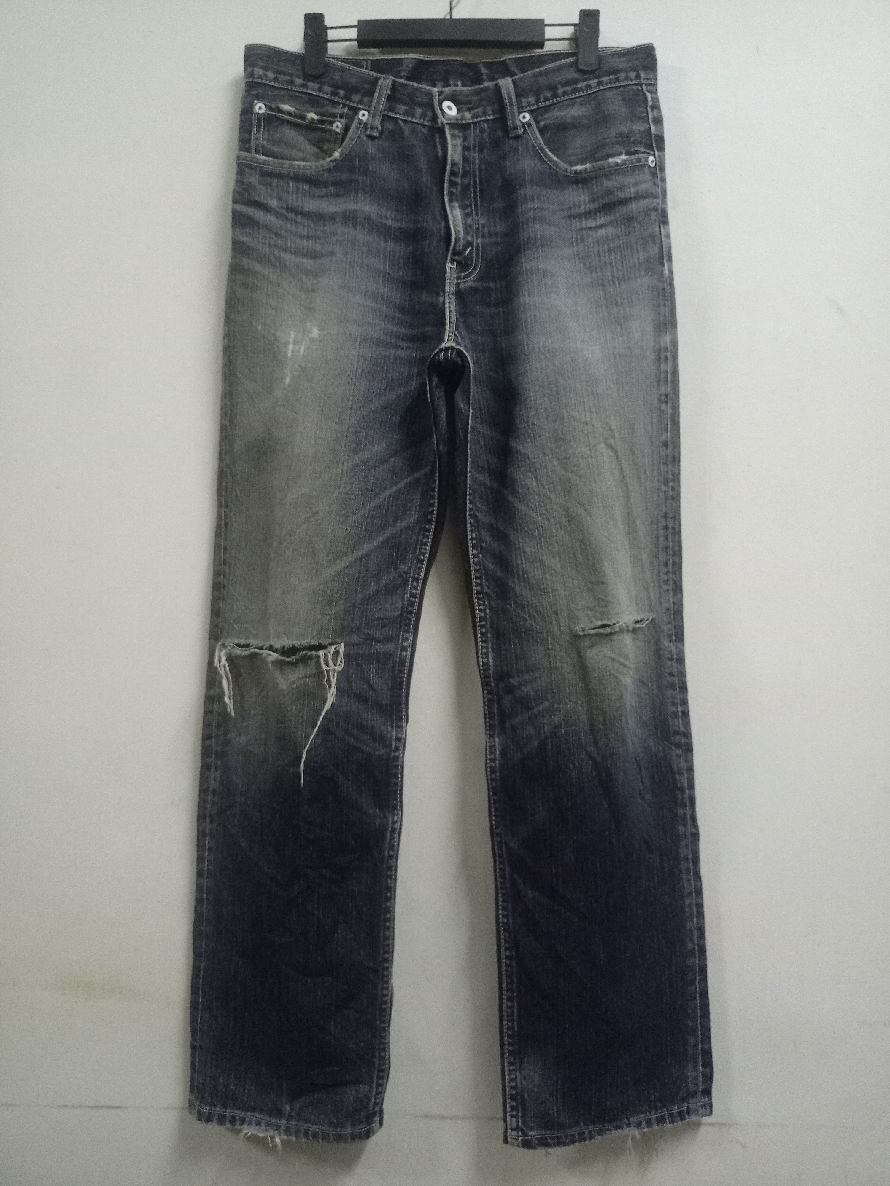 image of Distressed Denim x Levis Vintage 90's Levis 502 Sanforized Distressed Baggy Jeans in Indigo Blue (S