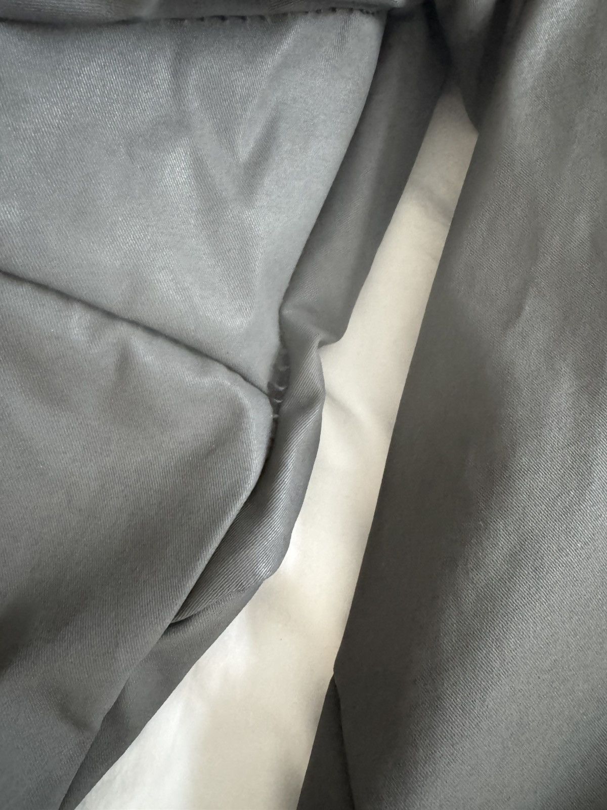 Unlined hand stitched hooded jacket.