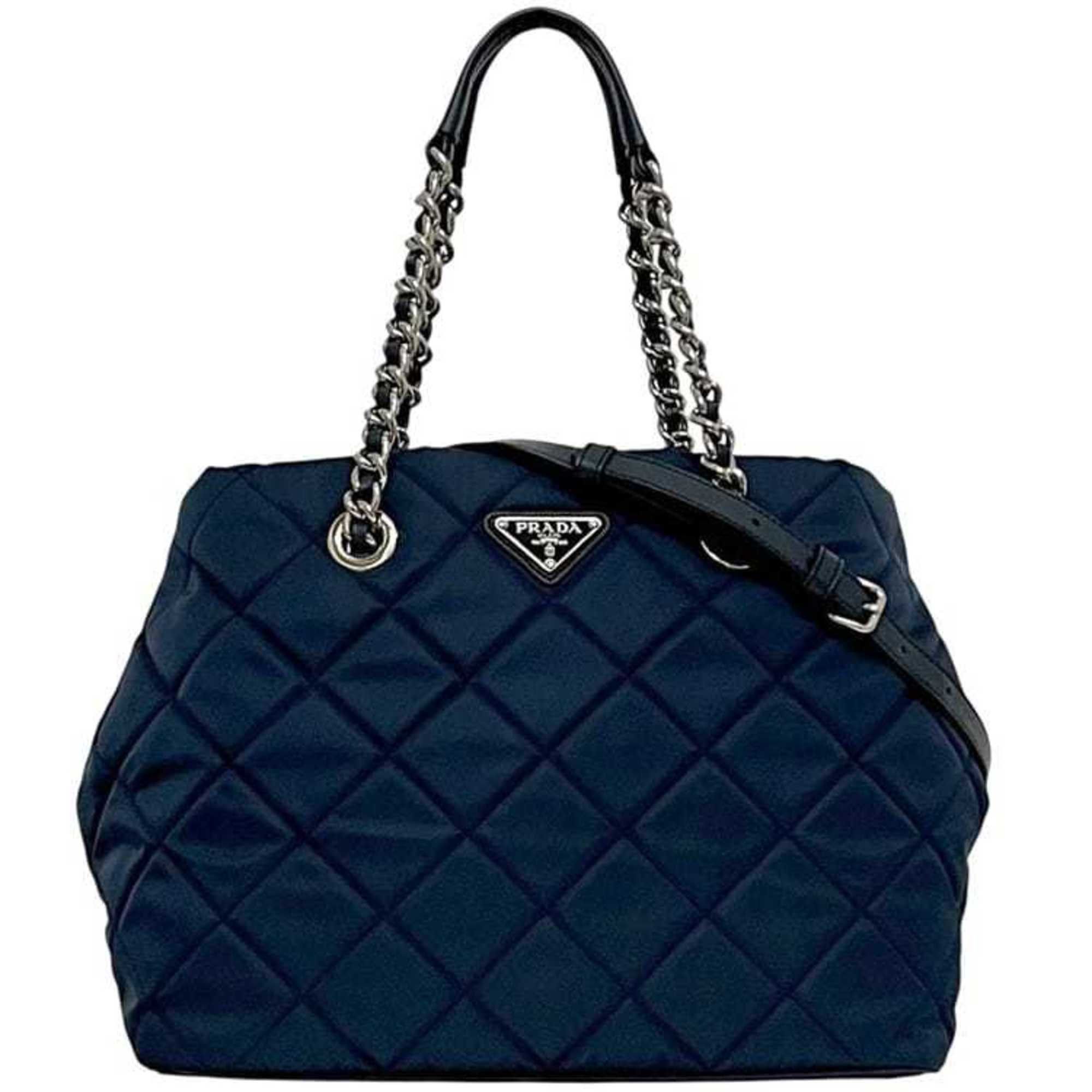 Prada 2-way bag f-24442 navy Tessuto 1BG740 tote in nylon and Saffiano leather. 165 PRADA shoulder bag chain with triangular plate design quilted.