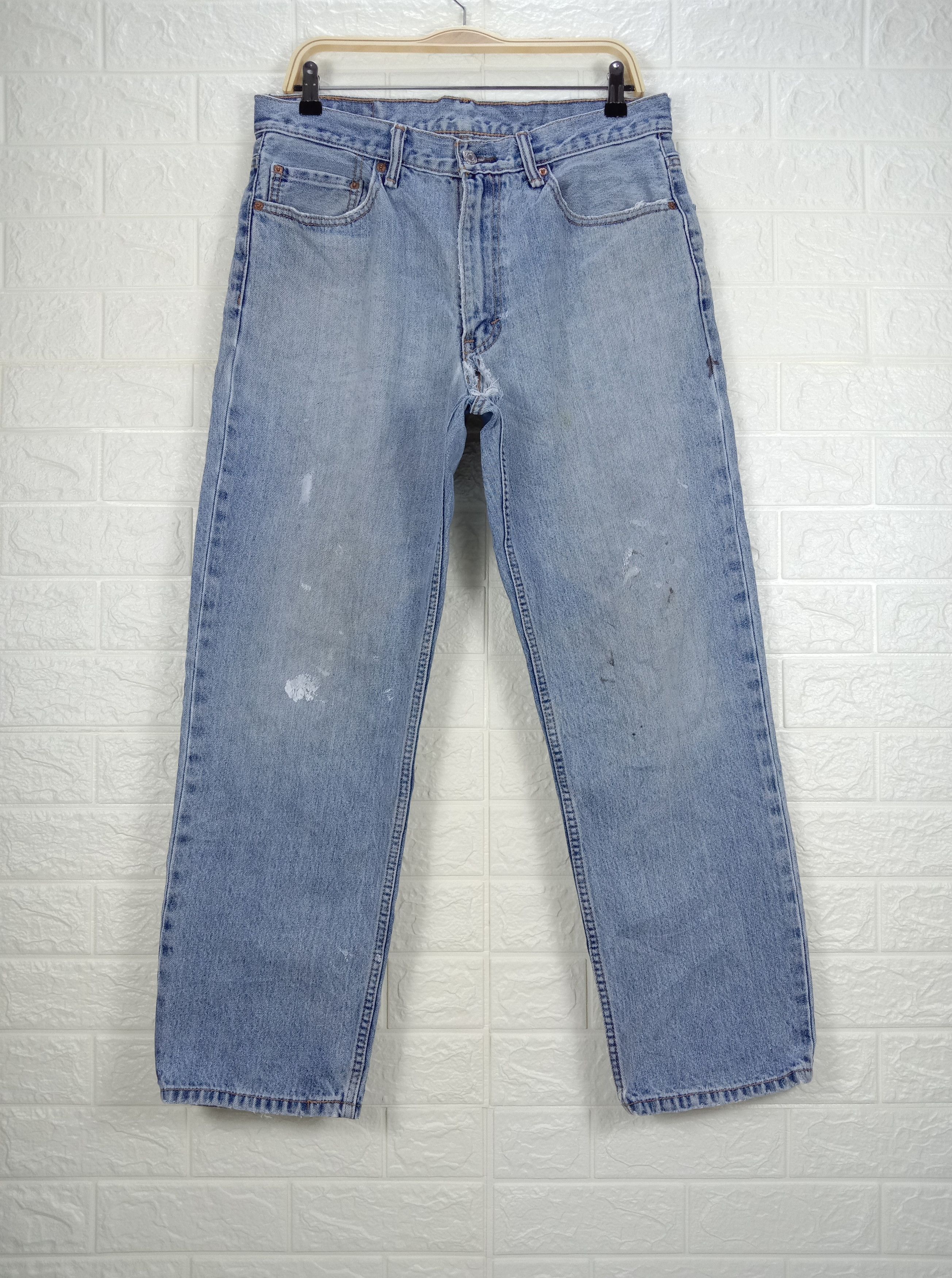 image of Vintage Levi's 550 Jeans Light Wash Distressed Denim in Blue, Men's (Size 32)