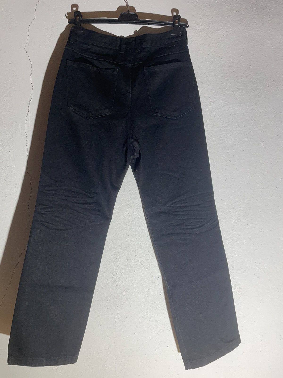 WE11DONE black distressed jeans