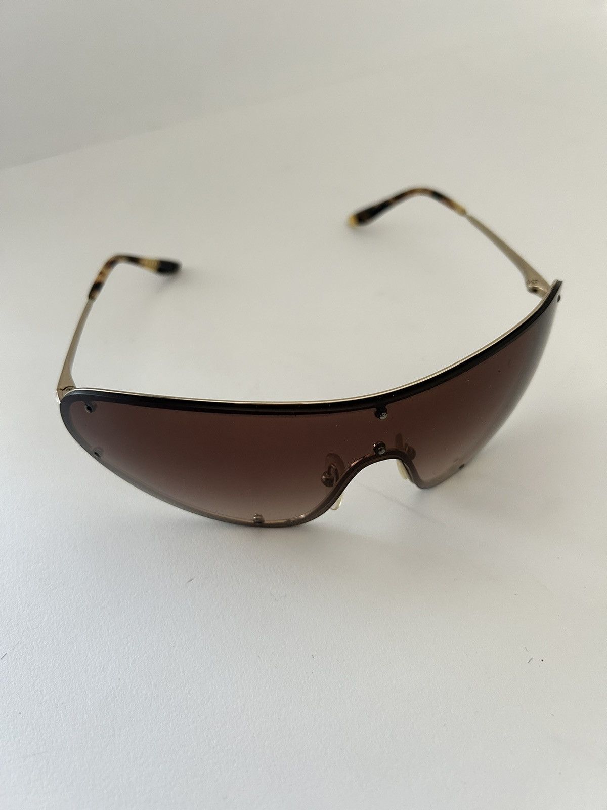 Prada Prada wrap around sunglasses tortoiseshell arms Size ONE SIZE - 1 Thumbnail