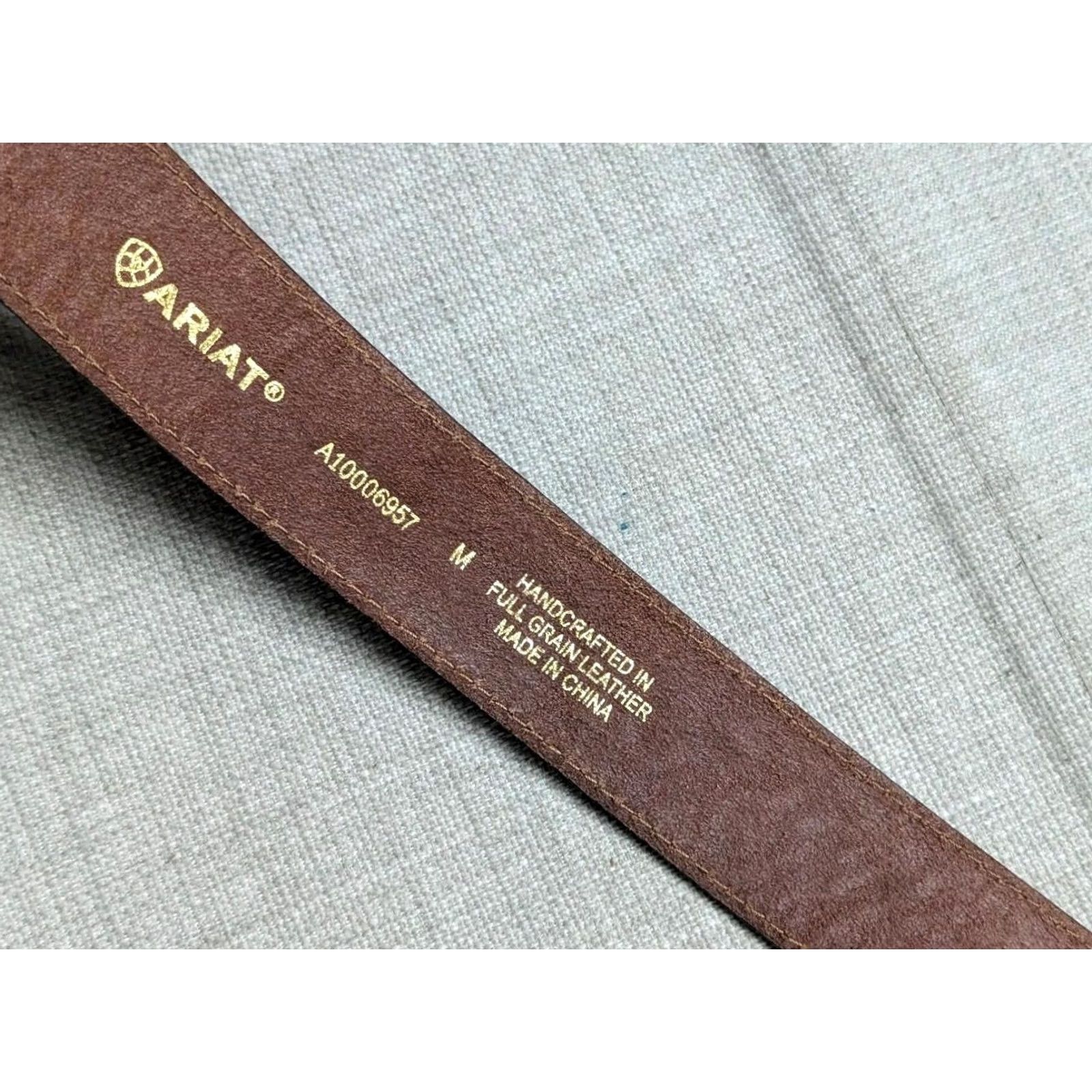 Ariat VINTAGE Ariat belt Tooled leather Western belt 34 Brown Mens 1-1/2" width Southwestern Cowboy Buckle belt 39.5" total length 31.5-35.5 belt holes Size 34 - 6 Thumbnail