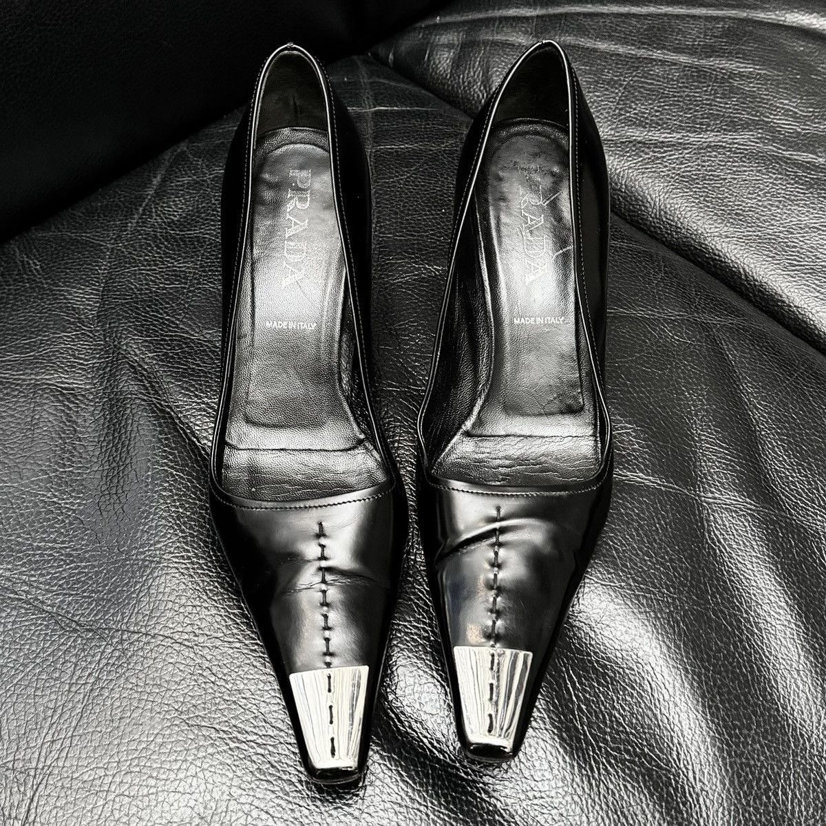 Prada heels with elongated pointed toes and metal toe