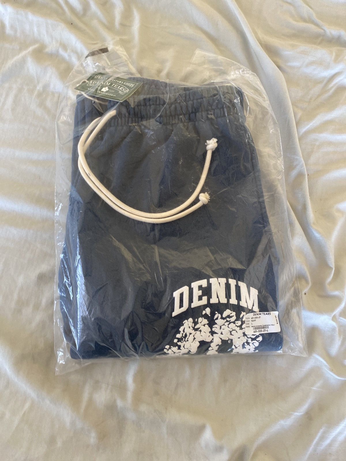 denim-tears-cotton-wreath-logo-spellout-grailed