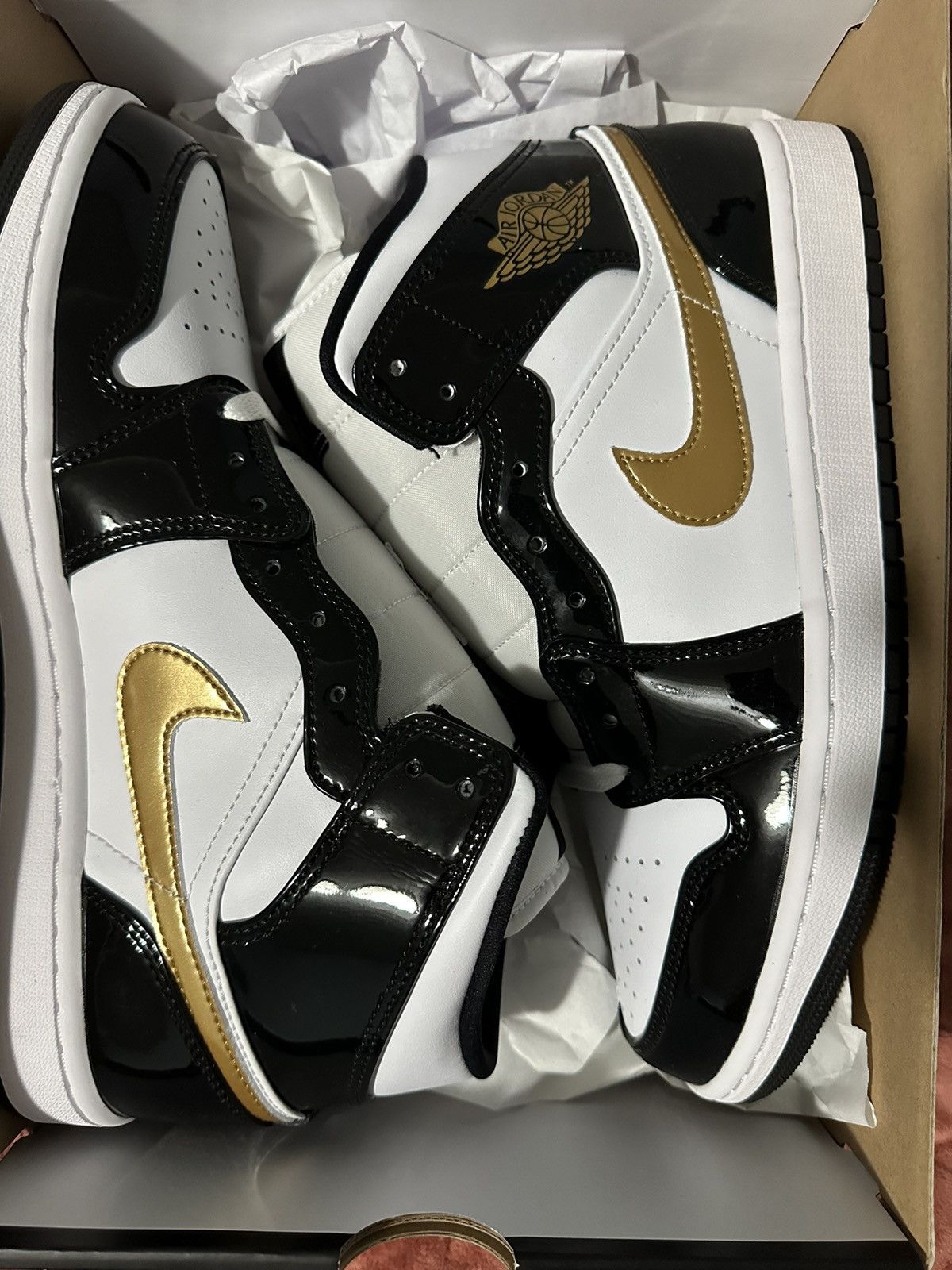 image of Jordan Brand 1 Mid Shoes in Black, Men's (Size 10)
