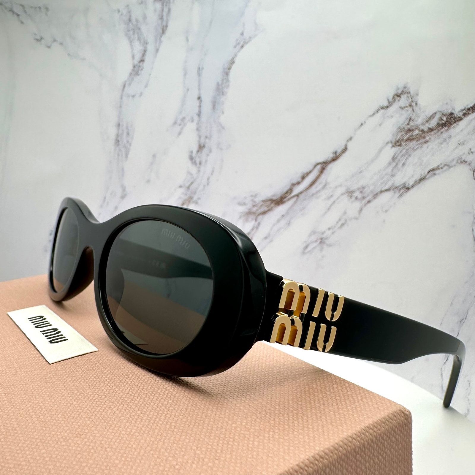Miu Miu NEW Miu Miu MU06ZS Black Oval Sunglasses | Grailed