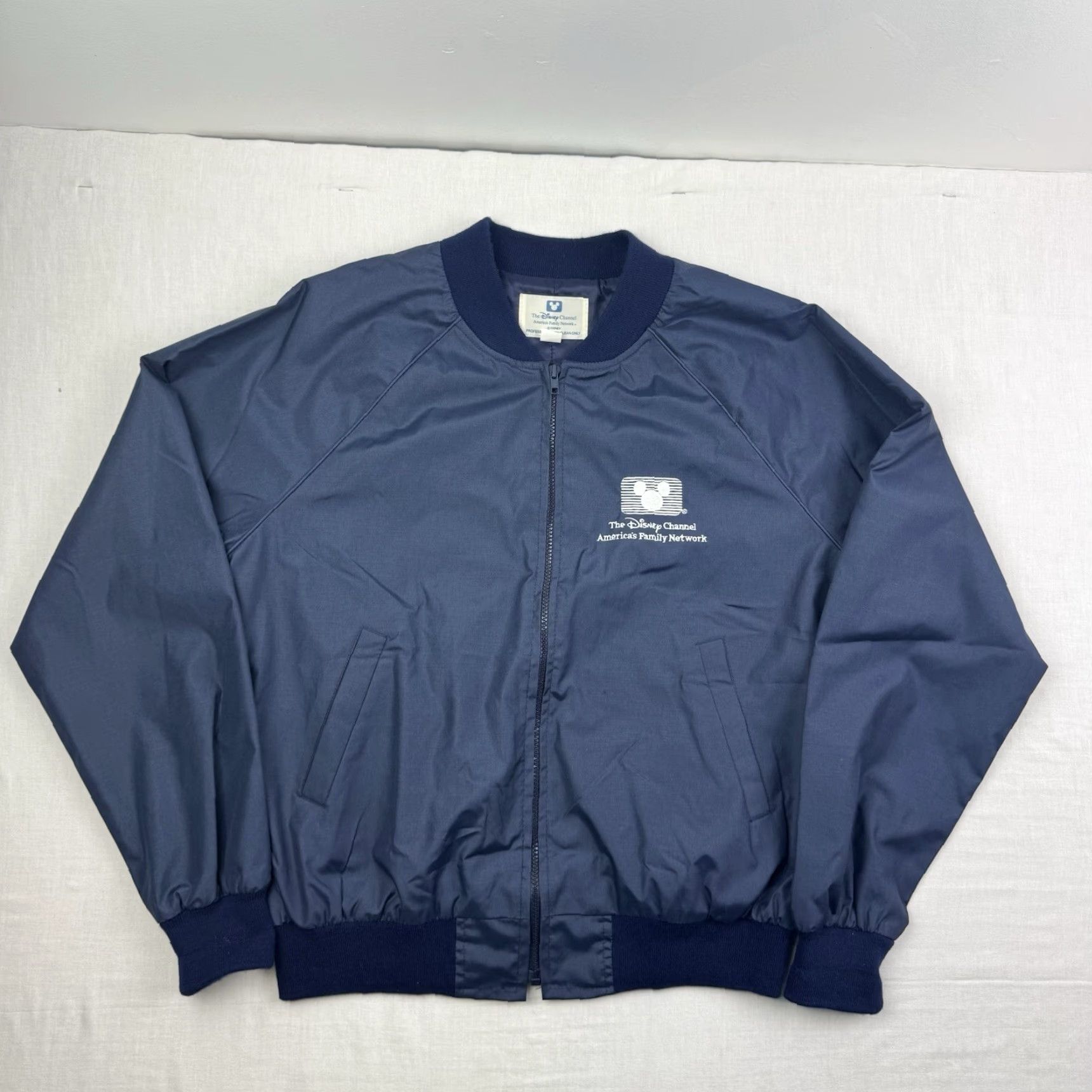 Disney VINTAGE Disney Windbreaker Jacket Men L Blue 80s Disney World Event 1980s Adults Mens Jacket Blue Disney Channel Windbreaker Size US L / EU 52-54 / 3 - 5 Thumbnail