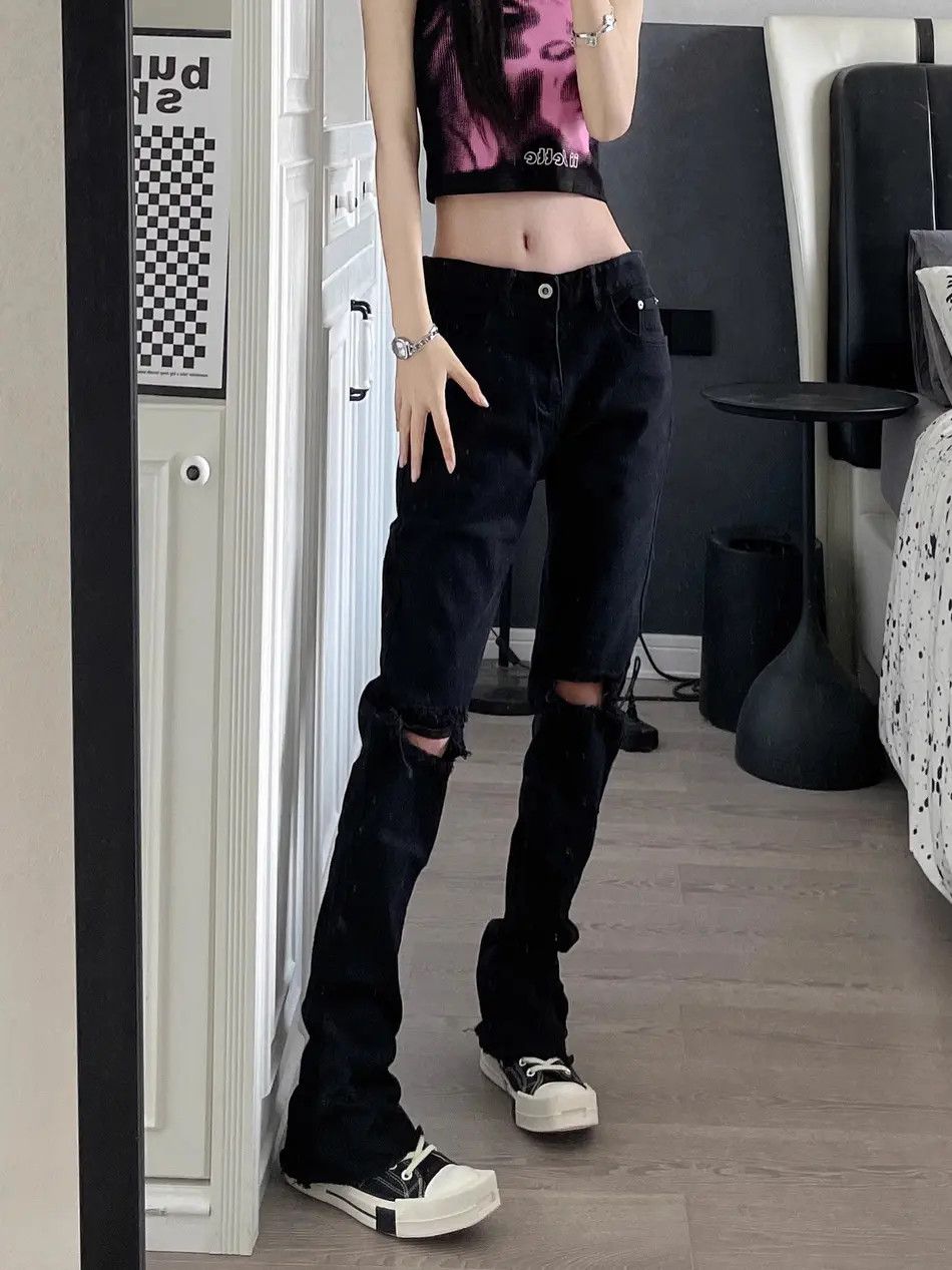 Micro flared black distressed ruffled denim jeans
