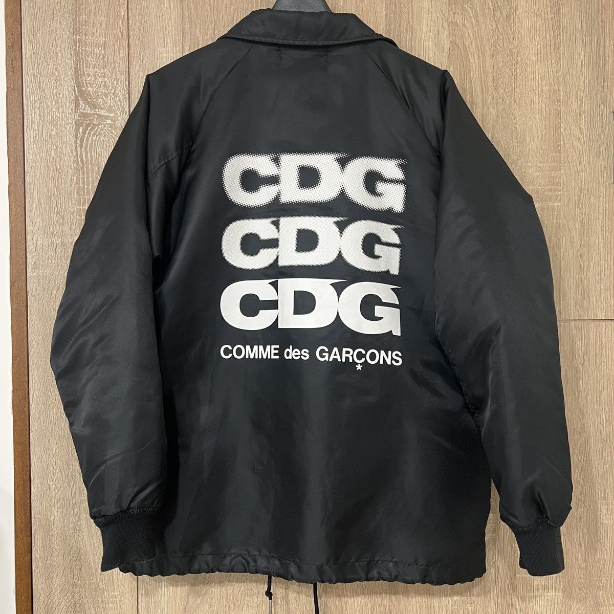 Cdg coach jacket sizing best sale