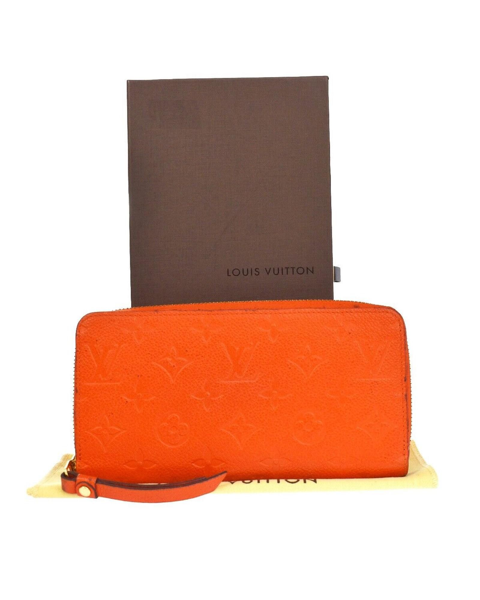 image of Louis Vuitton Contemporary Leather Wallet With Zipper Closure in Orange, Women's