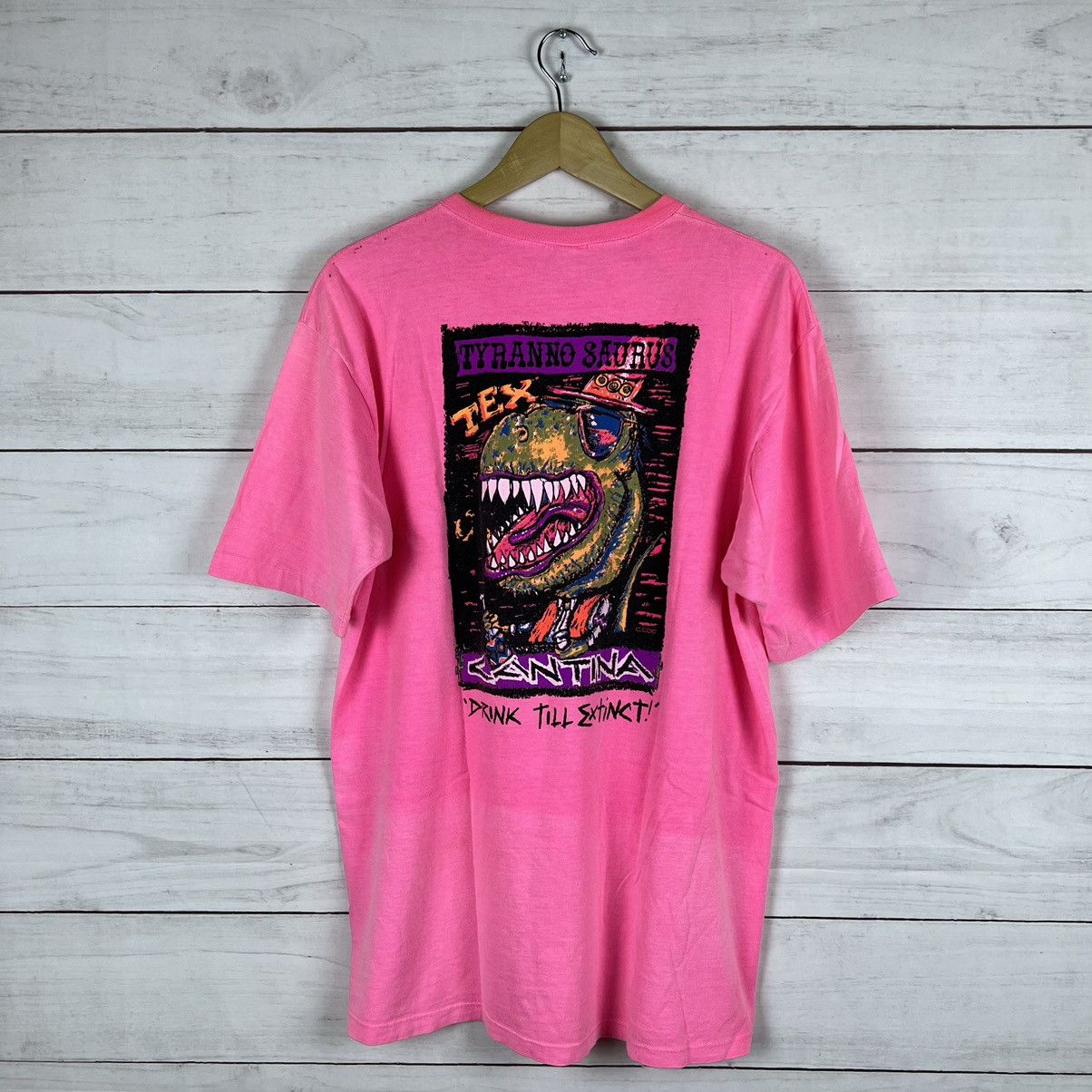 image of Crazy Shirts x Made In USA Vintage 1980S Crazy Shirt Hawaii Tyranno Saurus T-Shirt XL in Pink, Men'