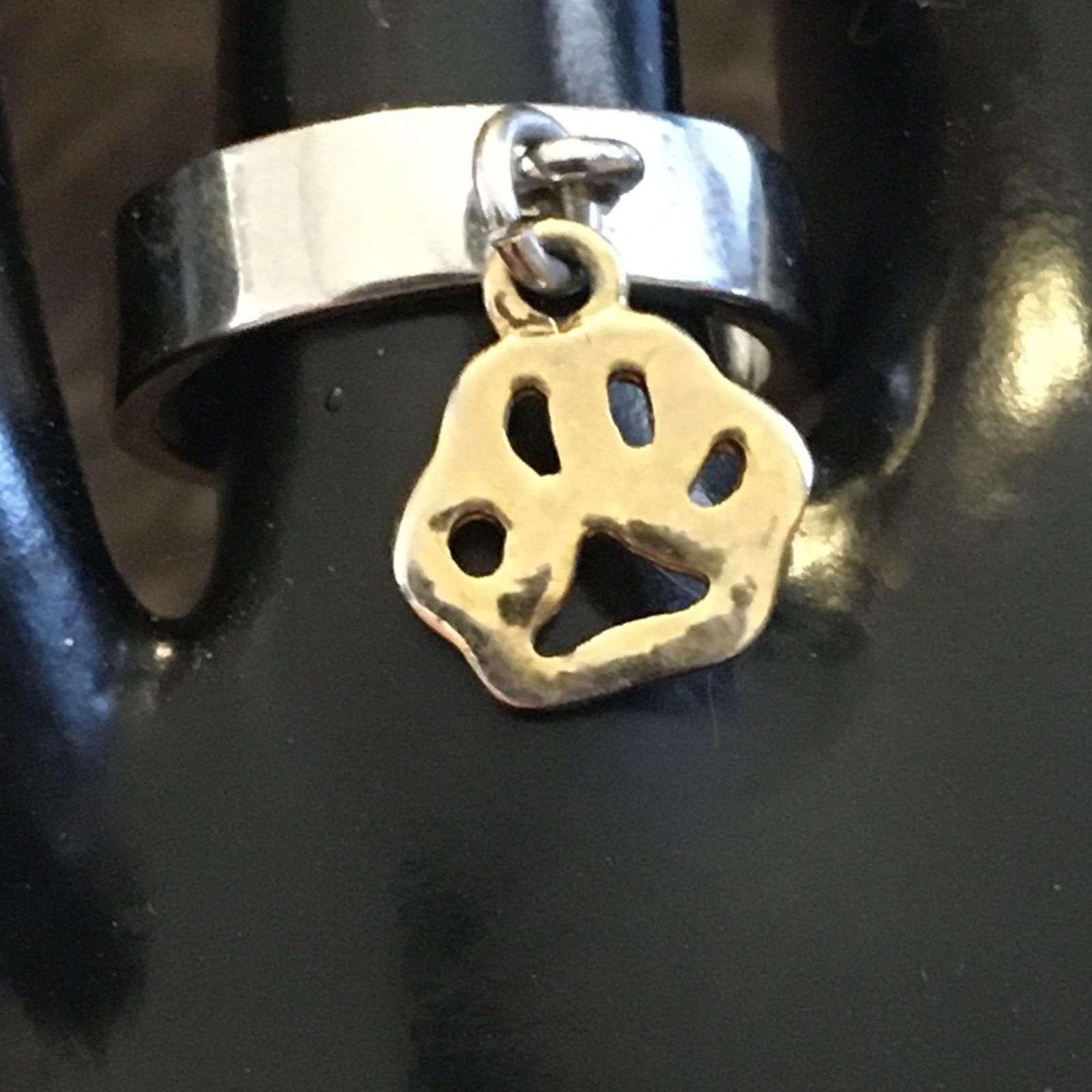Jewelry Silver band with gold paw print charm ring Size ONE SIZE - 6 Thumbnail