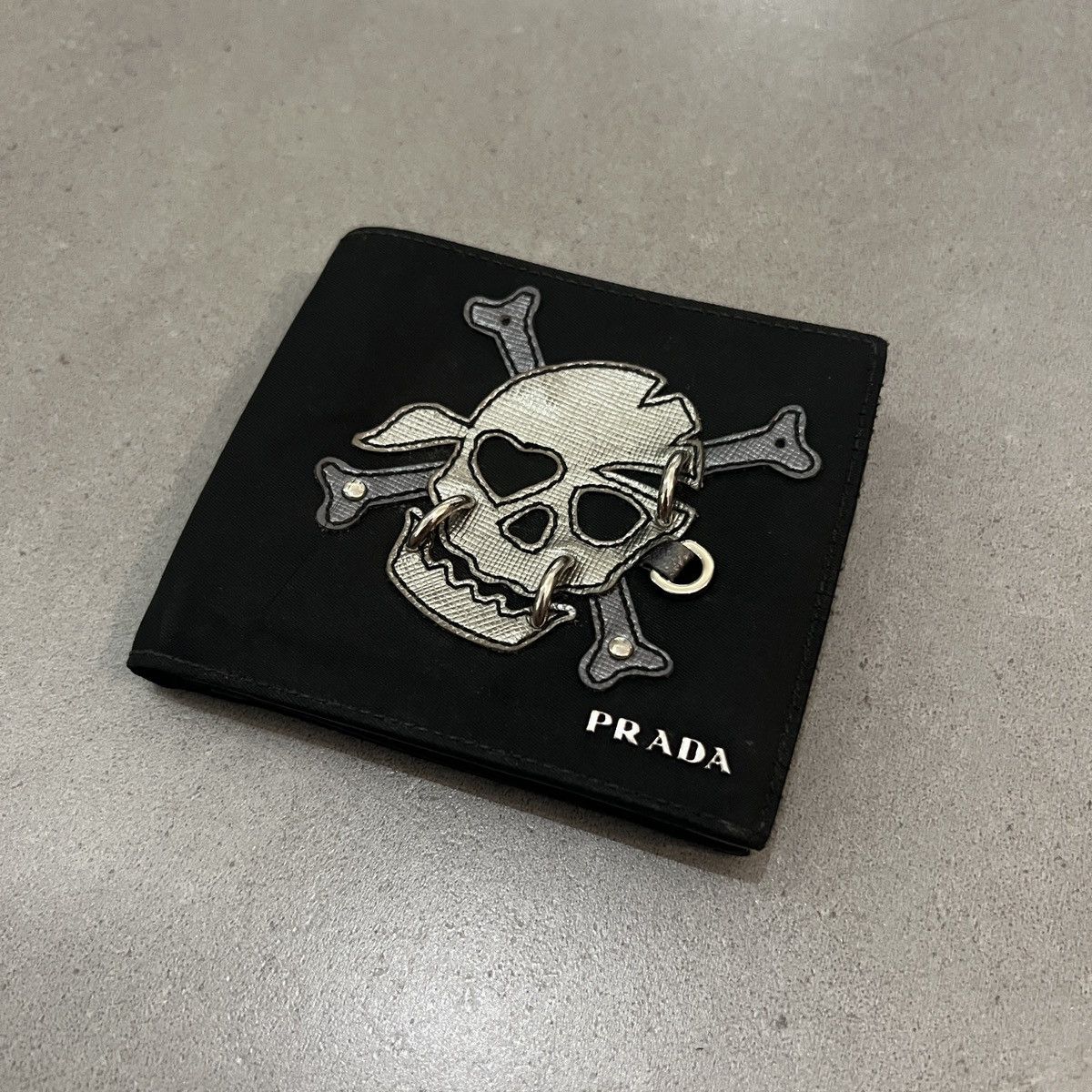 image of Ss12 Prada Tessuto Patchwork Skull Wallet With Piercings in Black, Men's